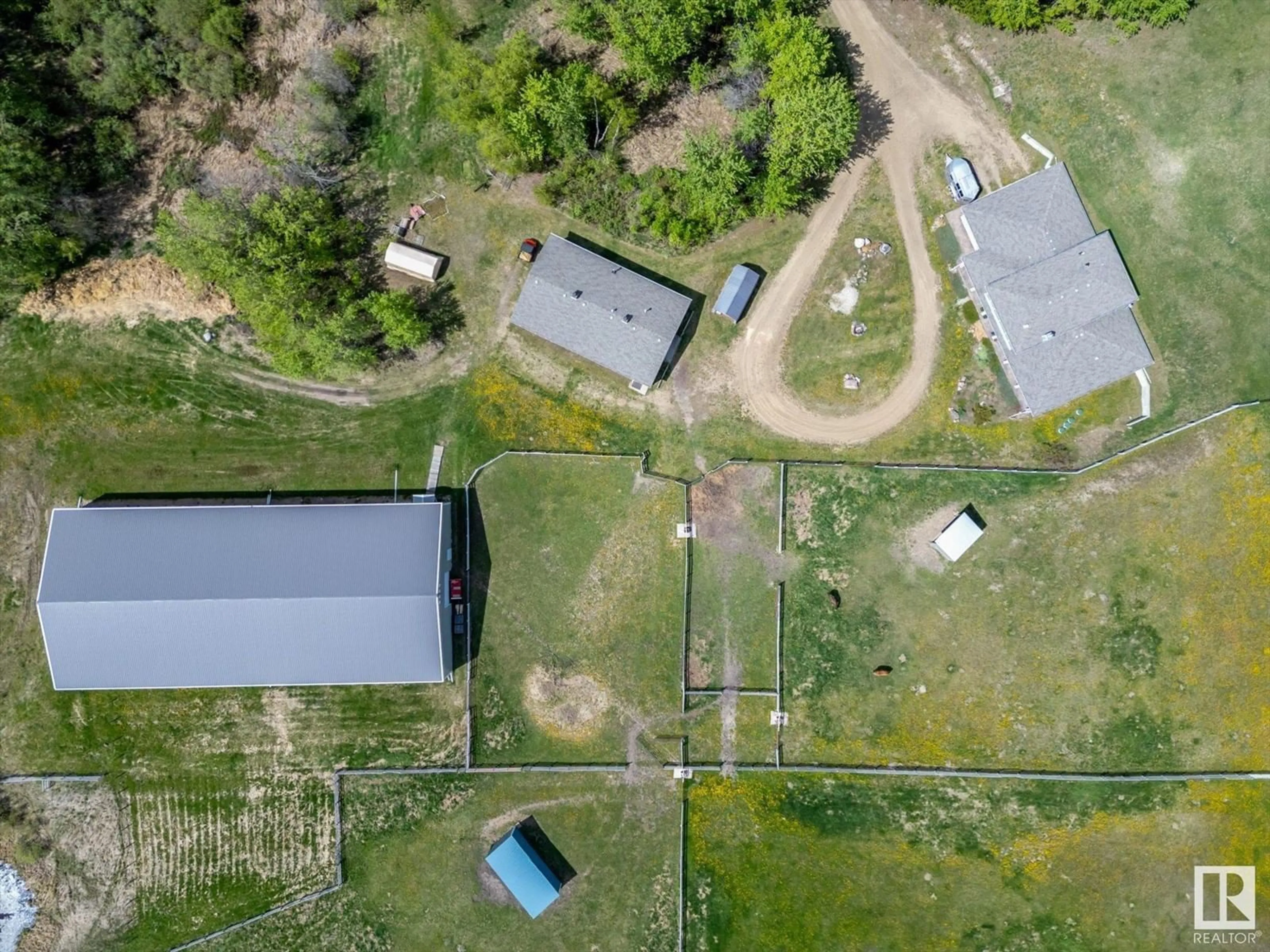 A pic from outside/outdoor area/front of a property/back of a property/a pic from drone, unknown for 21031 TWP RD 530, Rural Strathcona County Alberta T8G2C7