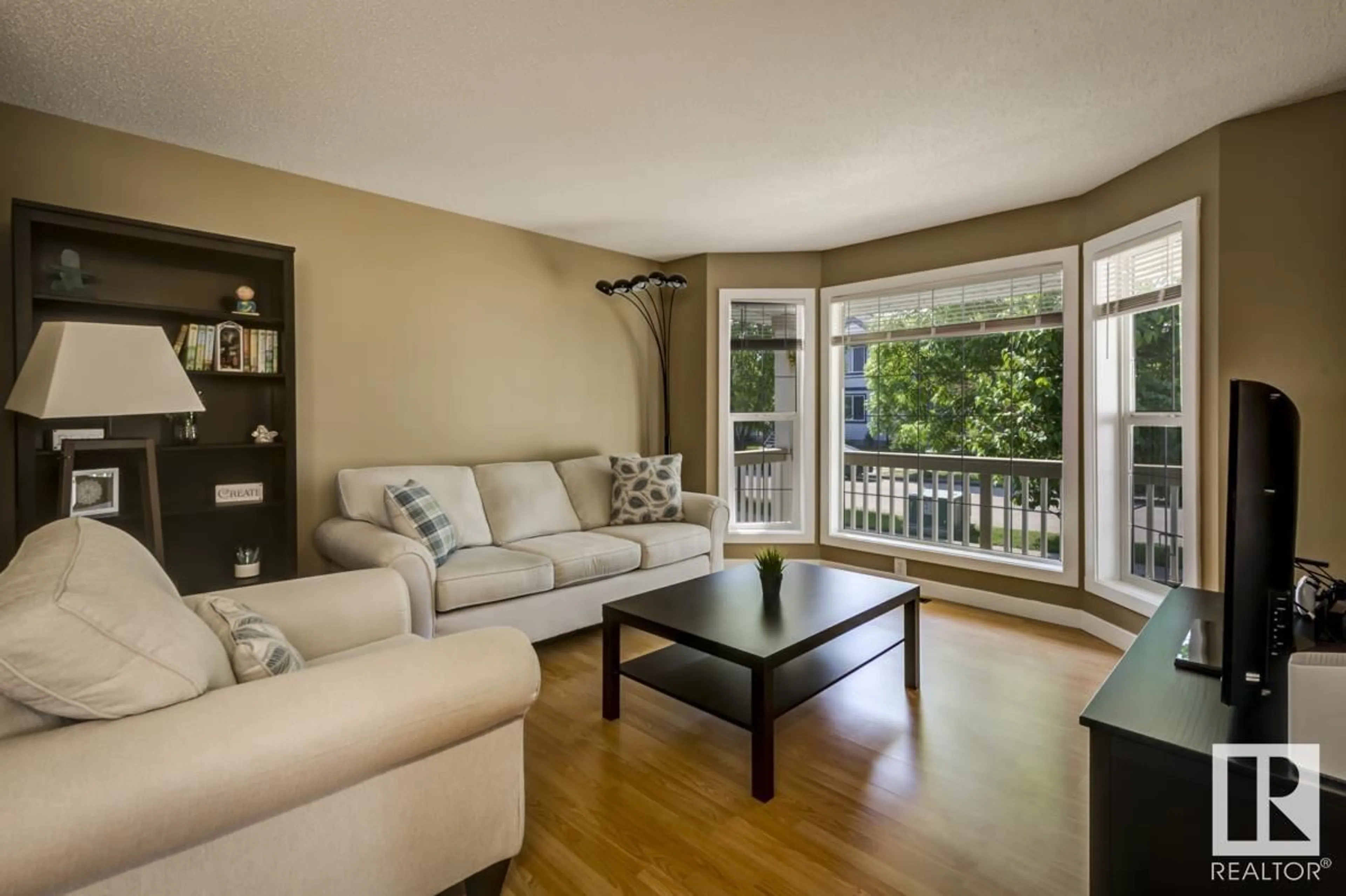 Living room with furniture, wood/laminate floor for 21316 88 AV, Edmonton Alberta T5T6V1