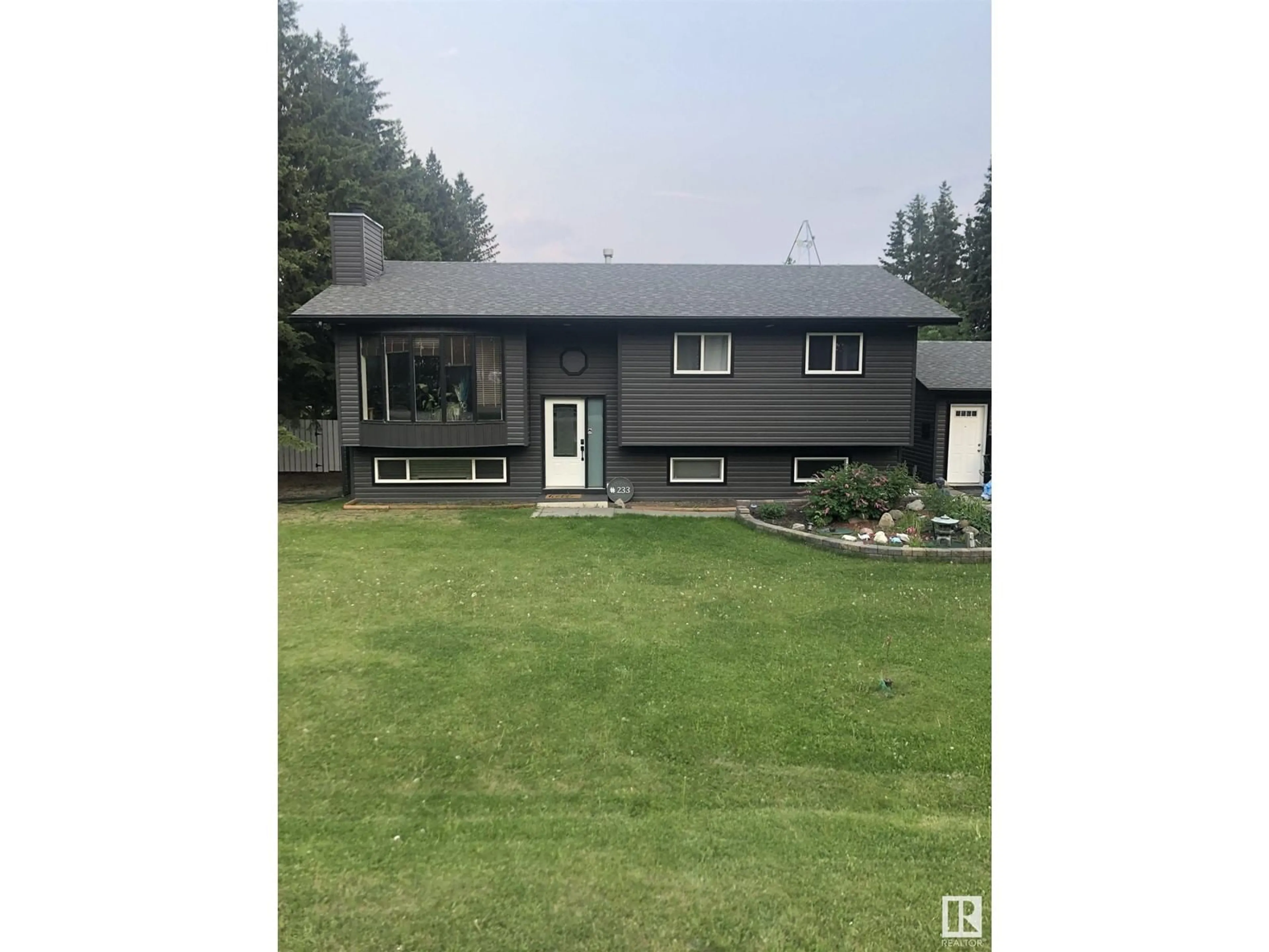 A pic from outside/outdoor area/front of a property/back of a property/a pic from drone, unknown for 233 - 52343 RGE ROAD 211, Rural Strathcona County Alberta T8G1A6