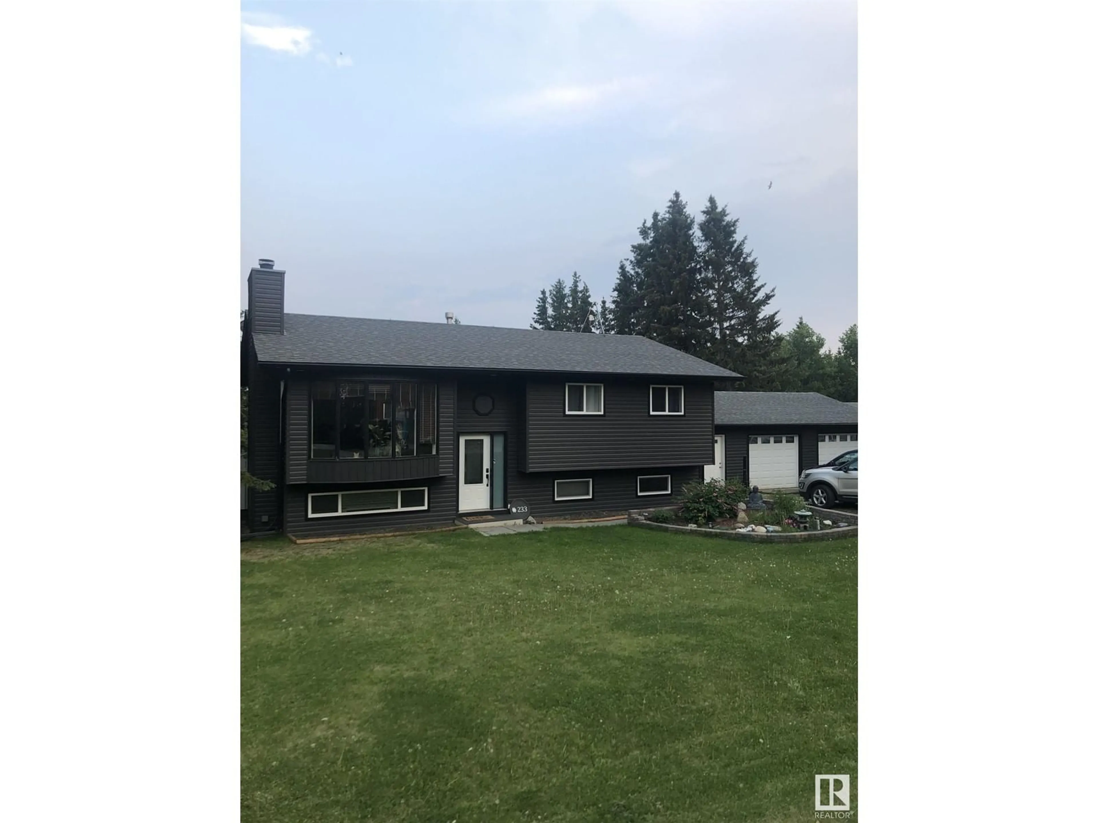 A pic from outside/outdoor area/front of a property/back of a property/a pic from drone, unknown for 233 - 52343 RGE ROAD 211, Rural Strathcona County Alberta T8G1A6