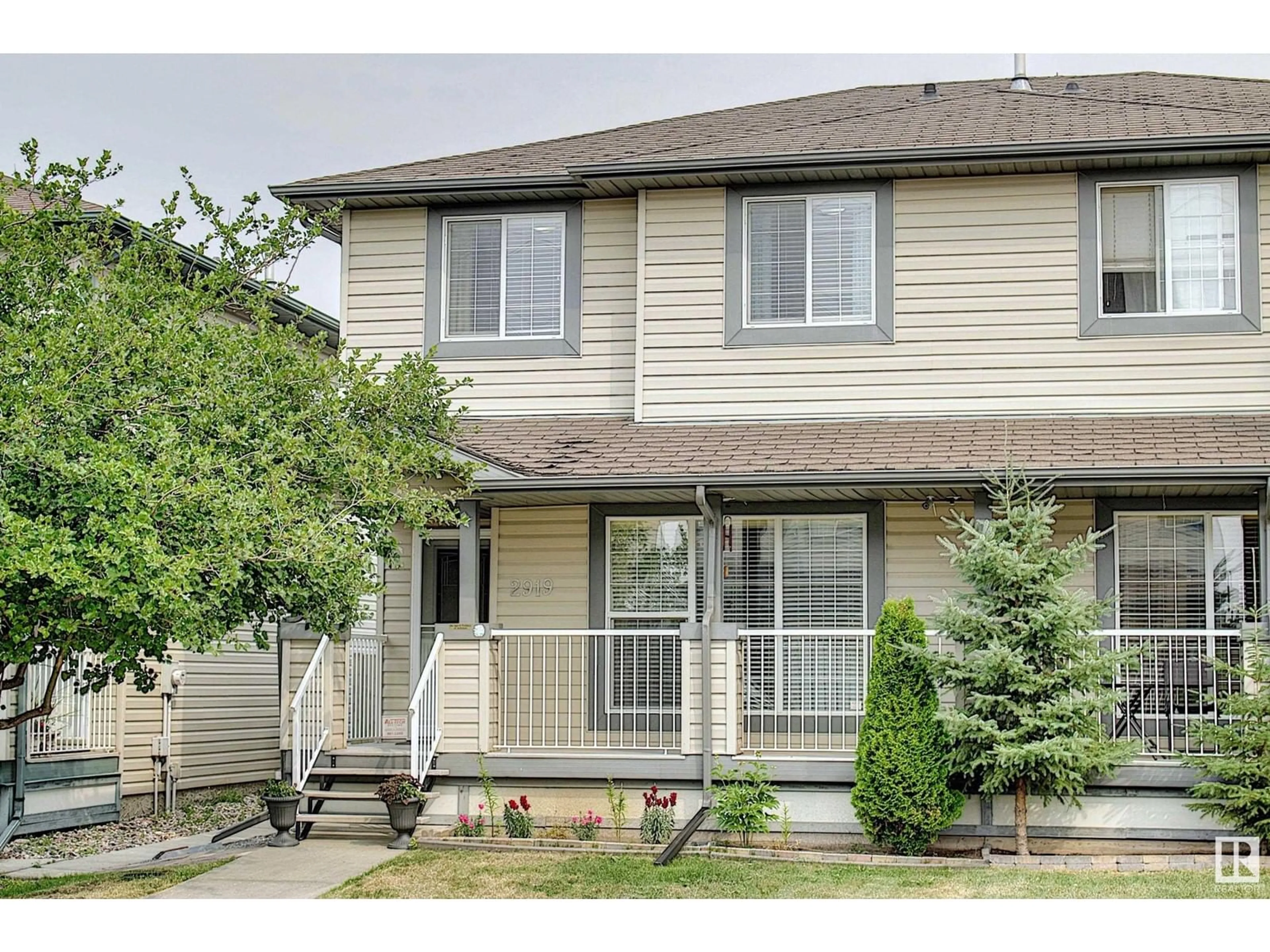 Home with vinyl exterior material, street for NW - 2919 26 ST, Edmonton Alberta T6T2A2