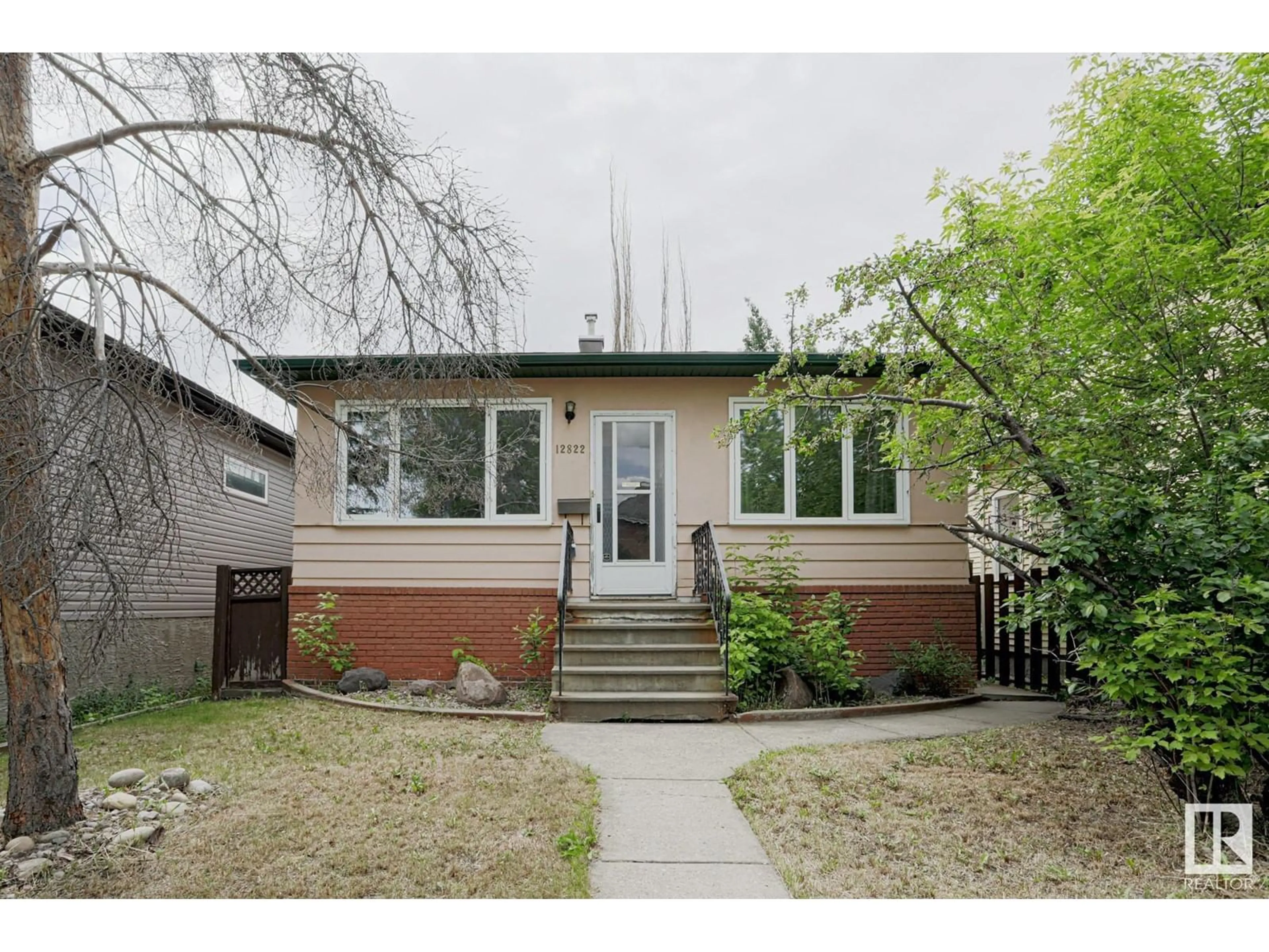 Home with brick exterior material, street for 12822 70 ST, Edmonton Alberta T5C0J8