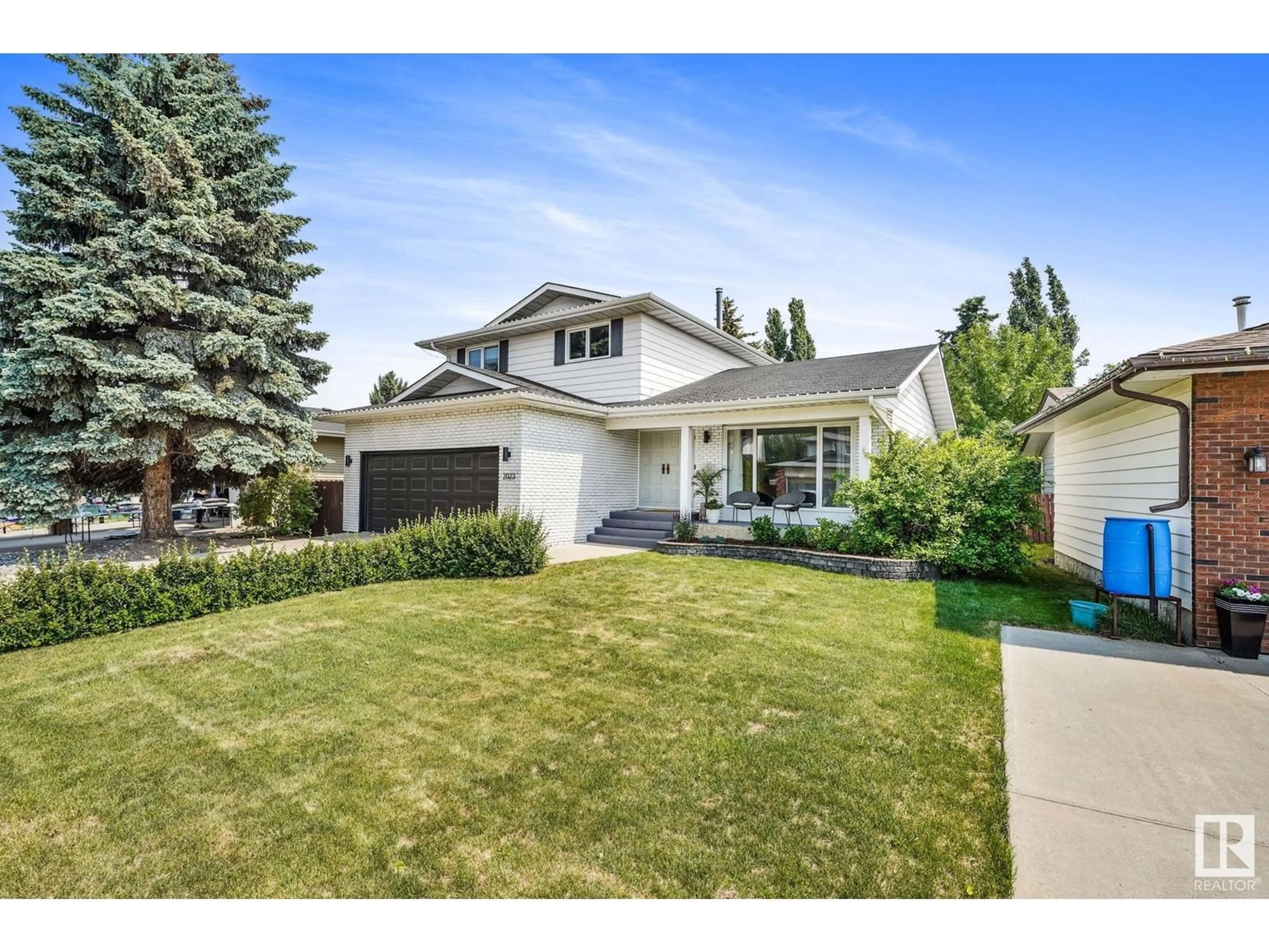 Home with vinyl exterior material, street for 2023 104B ST NW, Edmonton Alberta T6E5E7