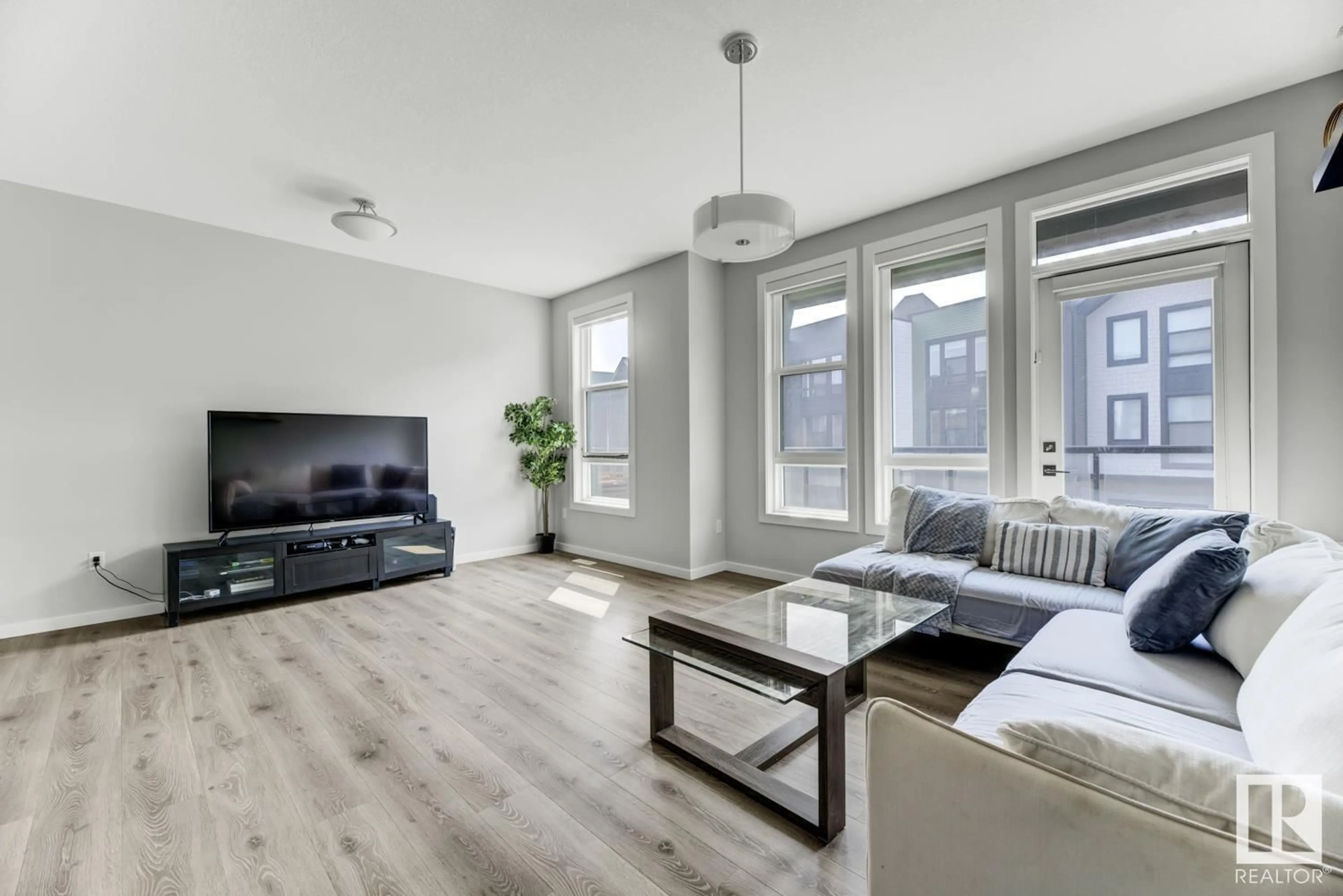 Living room with furniture, wood/laminate floor for #114 - 1304 RUTHERFORD RD, Edmonton Alberta T6W0B4