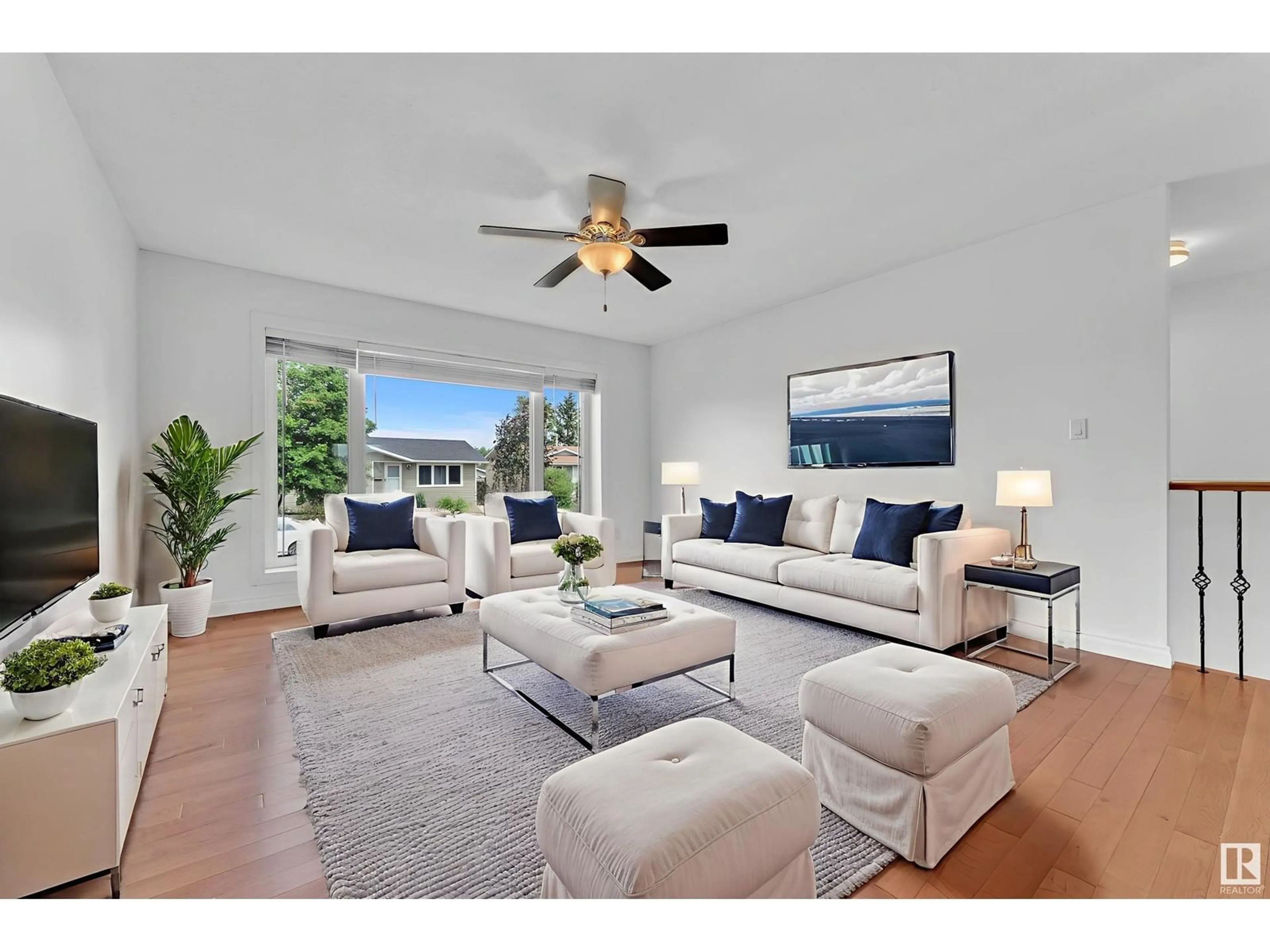 Living room with furniture, wood/laminate floor for 3019 133 AV, Edmonton Alberta T5A2Z4