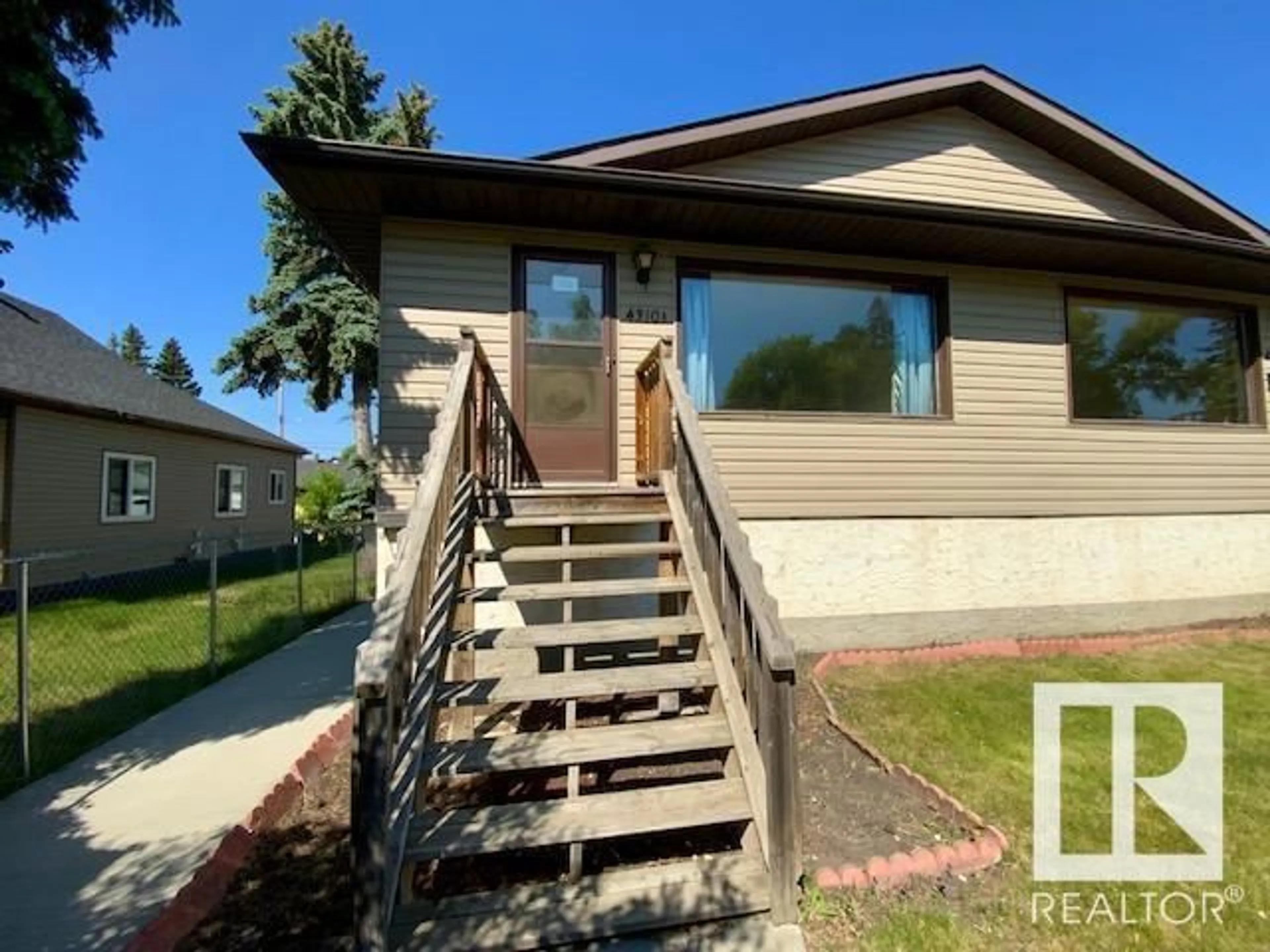 Home with vinyl exterior material, street for #A&B - 4310 52 ST, Wetaskiwin Alberta T9A1N4