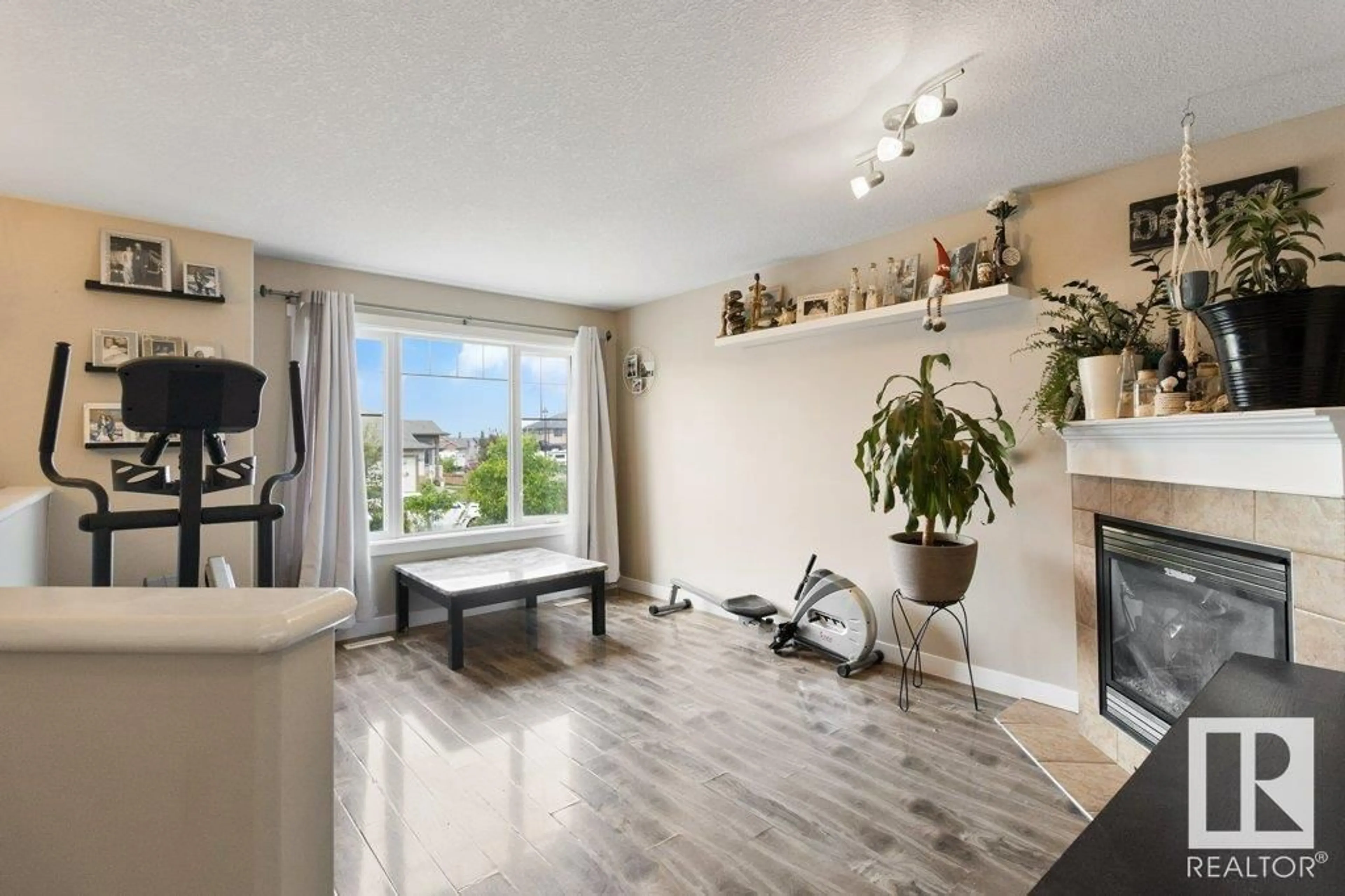 Living room with furniture, wood/laminate floor for 29 WALTERS CO, Leduc Alberta T9E0H9