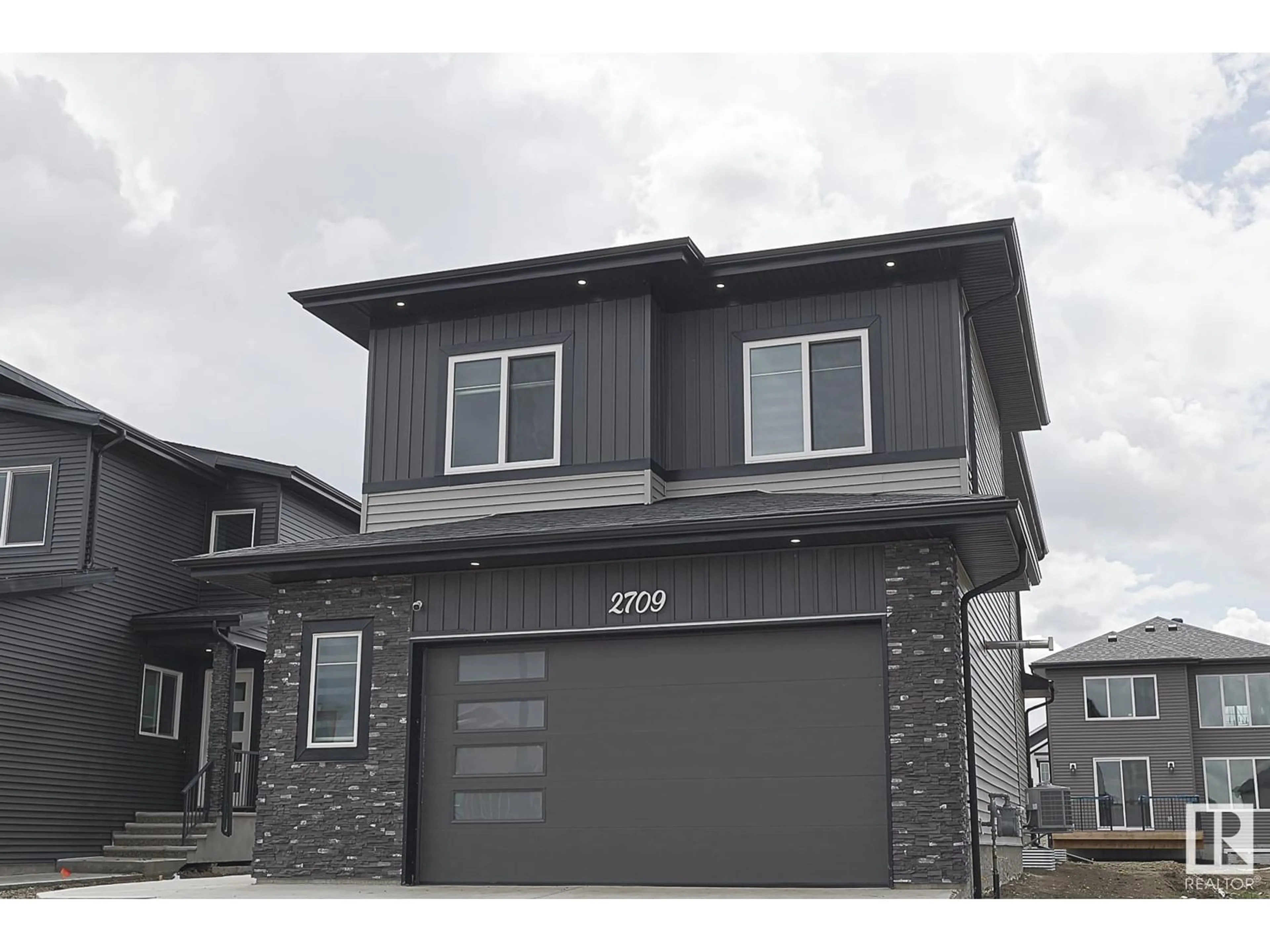 Home with vinyl exterior material, street for 2709 62 AVE, Rural Leduc County Alberta T4X3A5