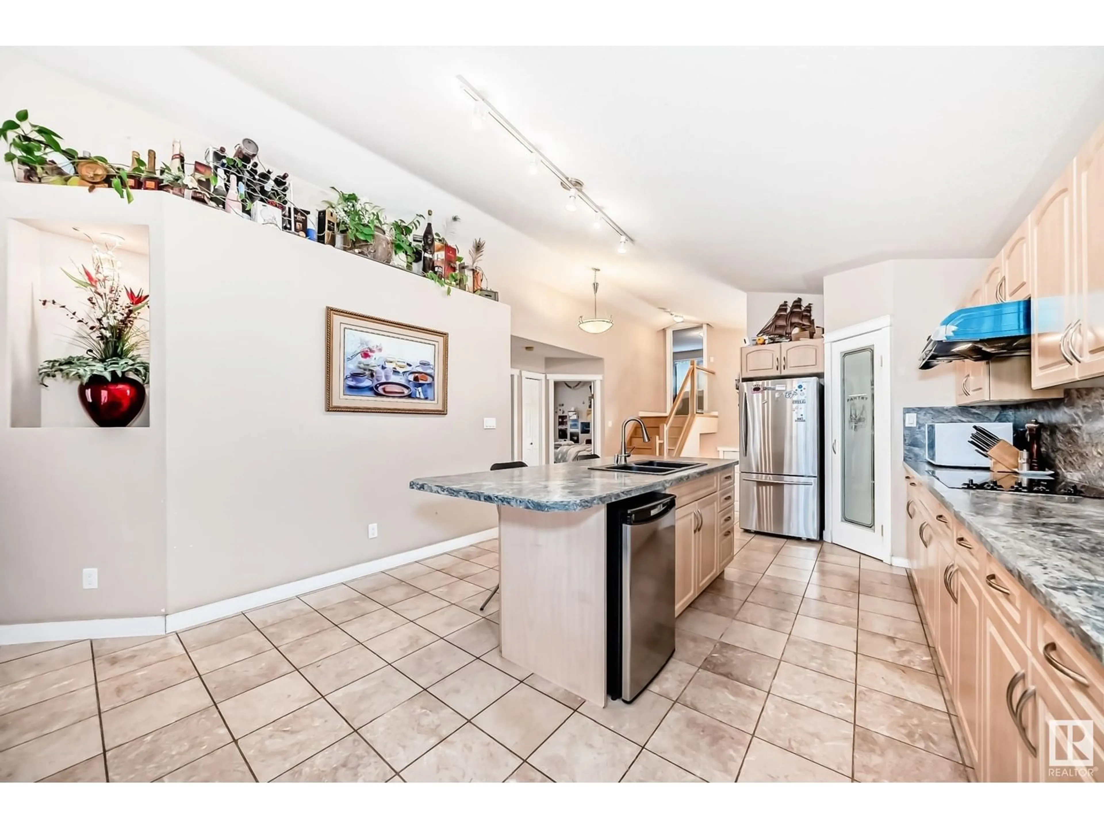 Open concept kitchen, ceramic/tile floor for 10632 180 AV, Edmonton Alberta T5X6J9