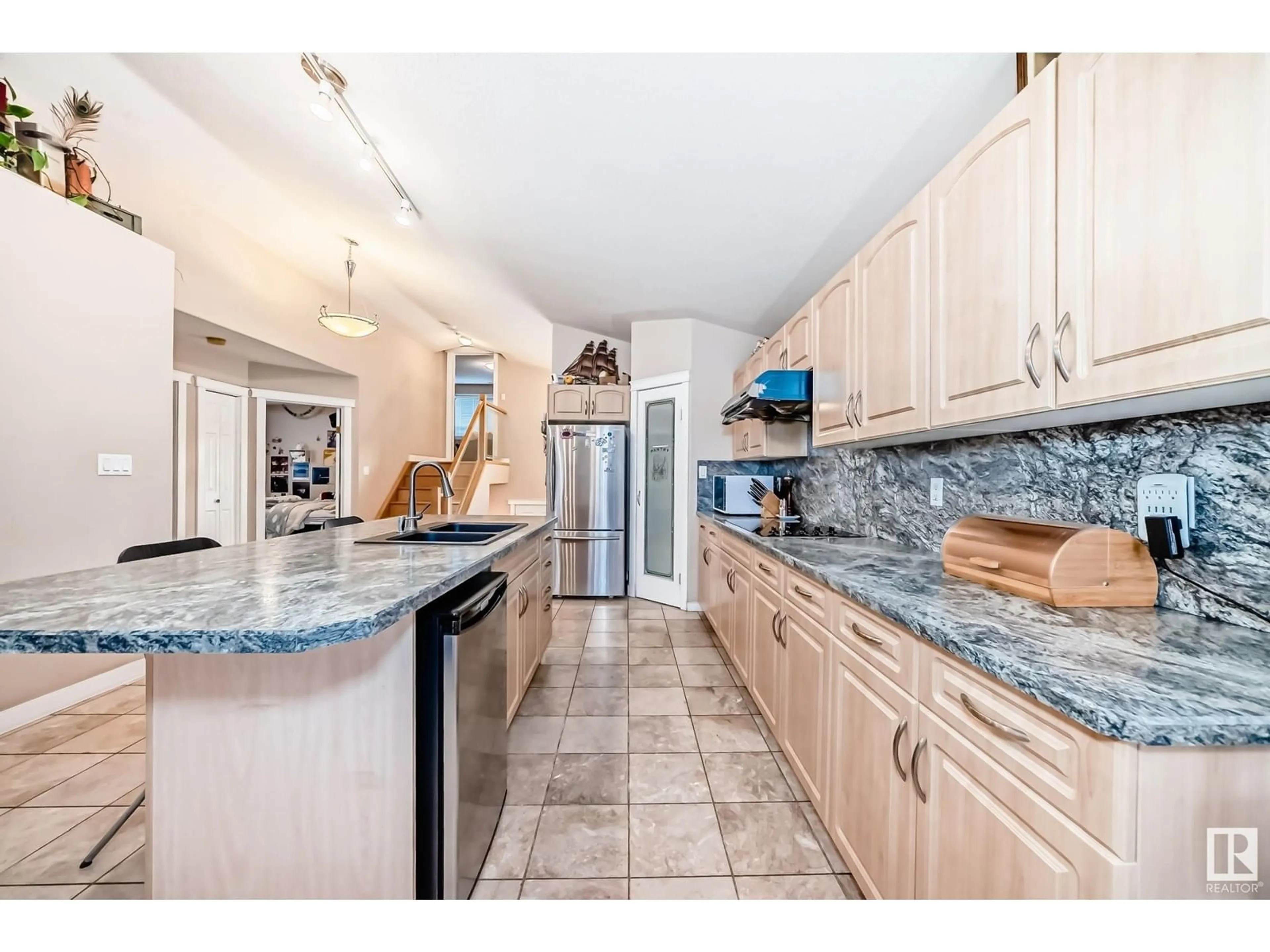 Open concept kitchen, ceramic/tile floor for 10632 180 AV, Edmonton Alberta T5X6J9
