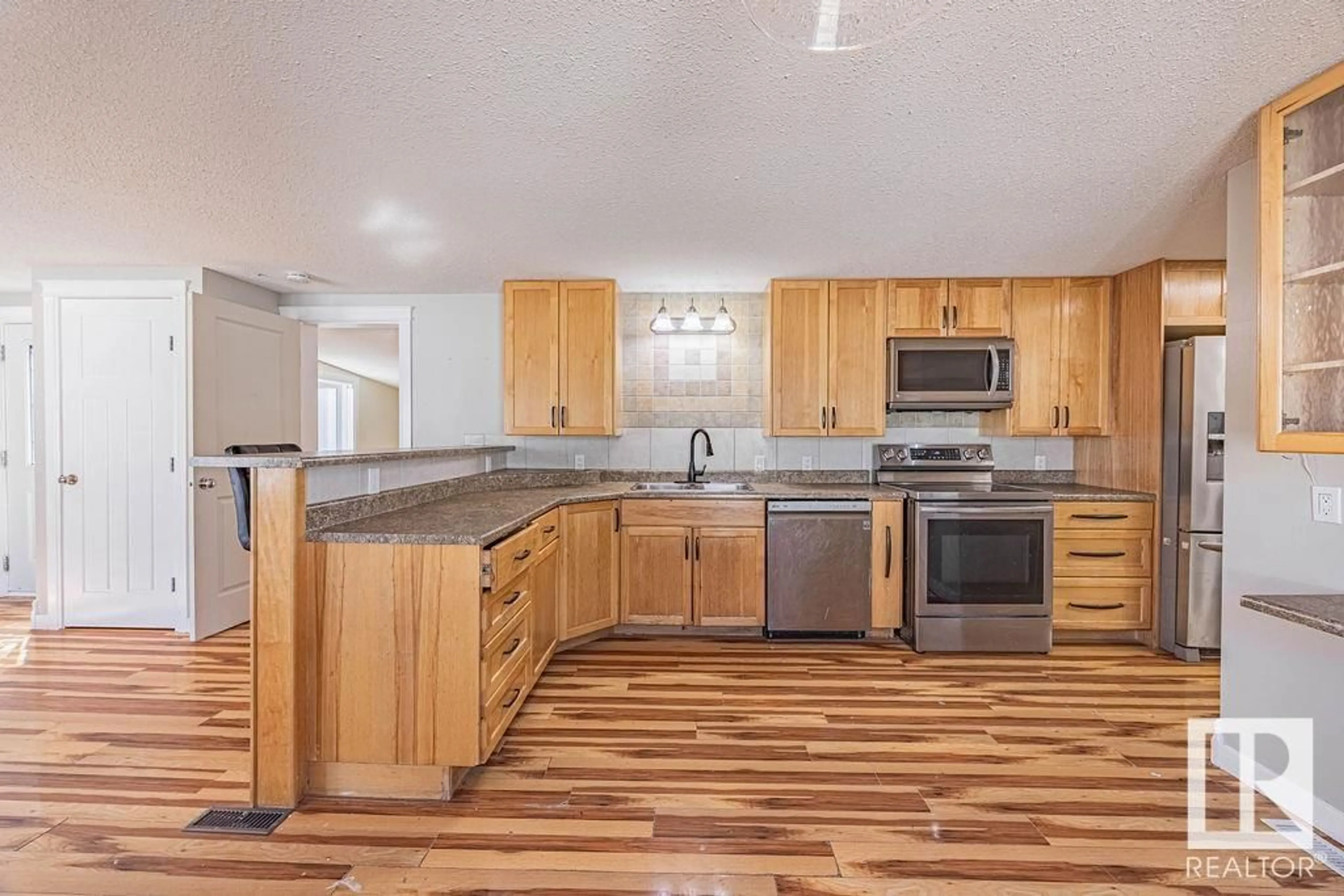 Open concept kitchen, unknown for 1438 LAKELAND VILLAGE, Sherwood Park Alberta T8H1L9