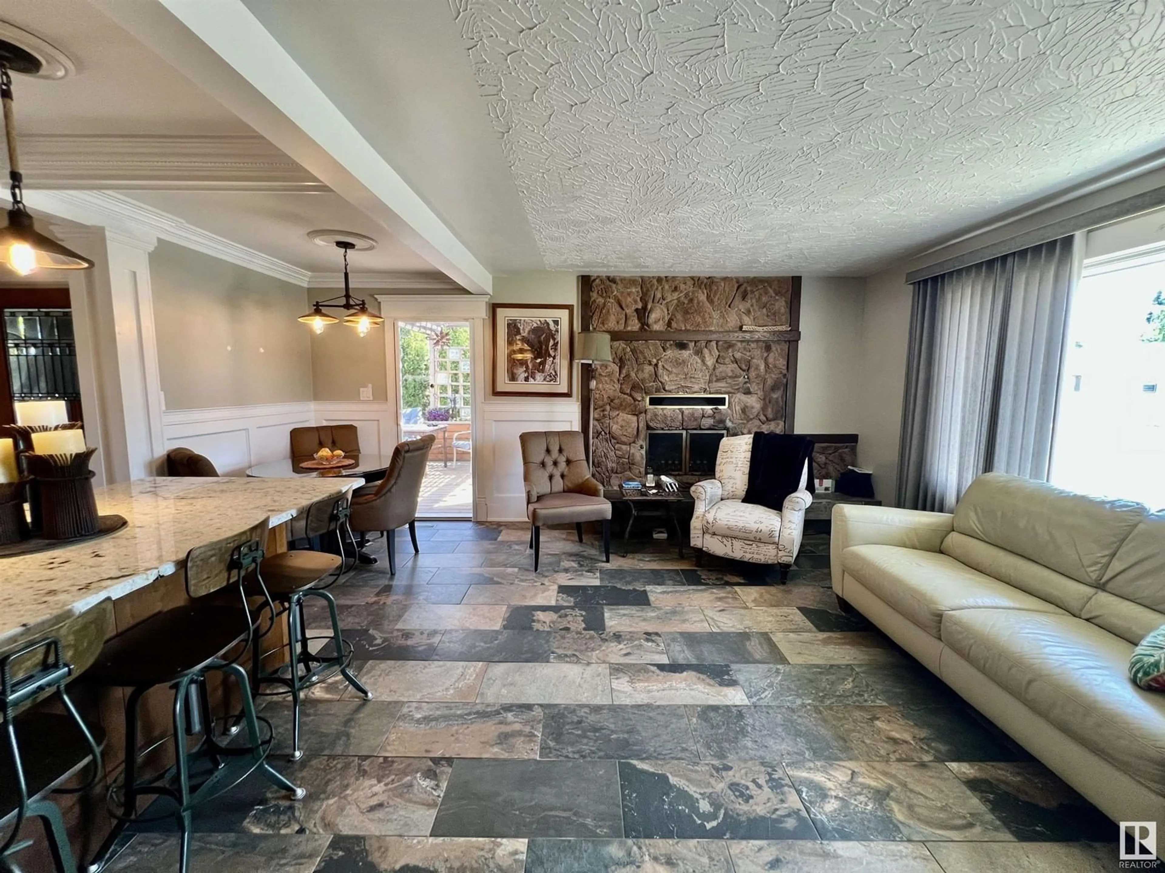 Living room with furniture, ceramic/tile floor for 8812 130 AV, Edmonton Alberta T5E0R9
