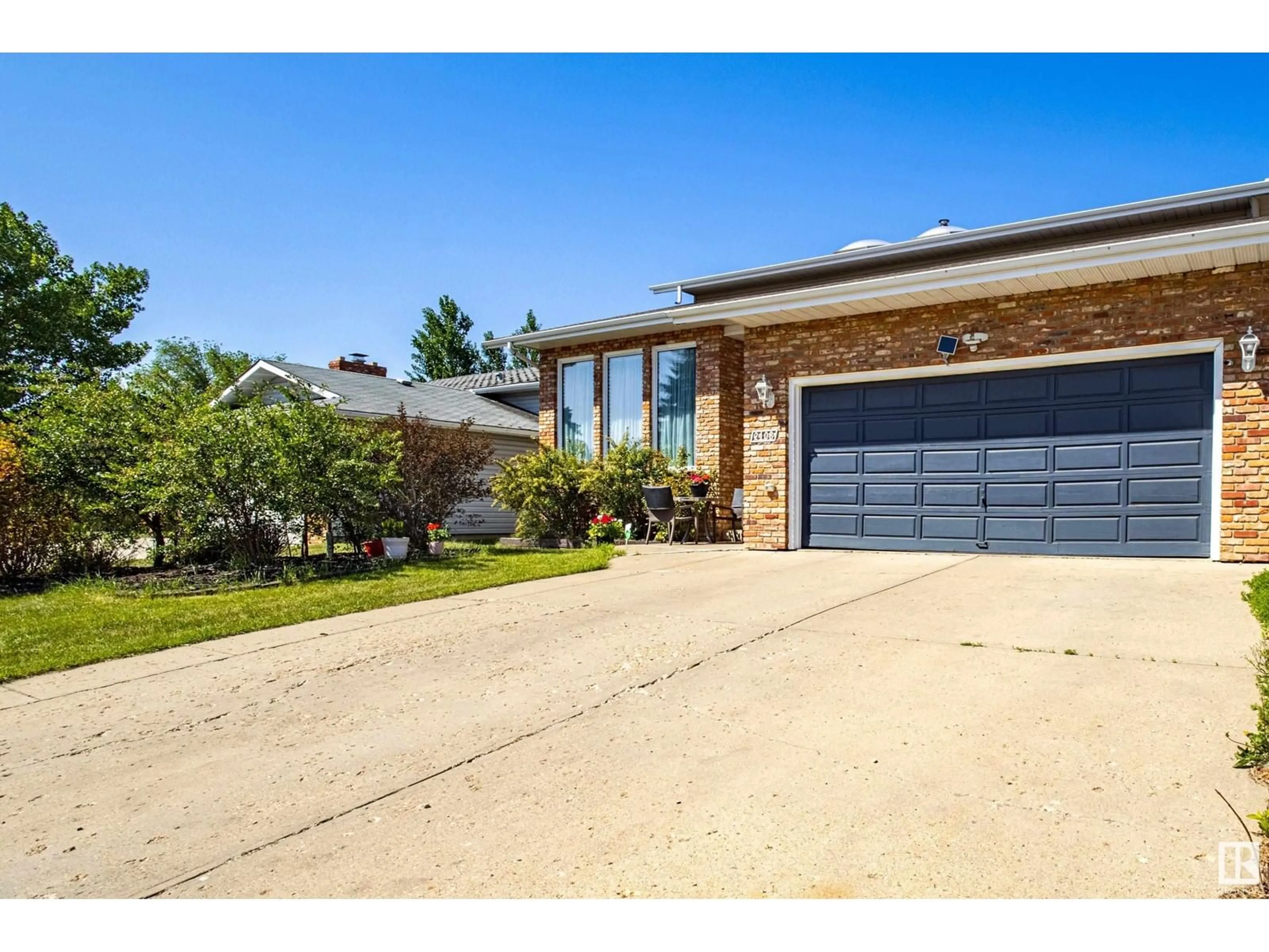Home with brick exterior material, street for NW - 2108 104B ST, Edmonton Alberta T6J5G8