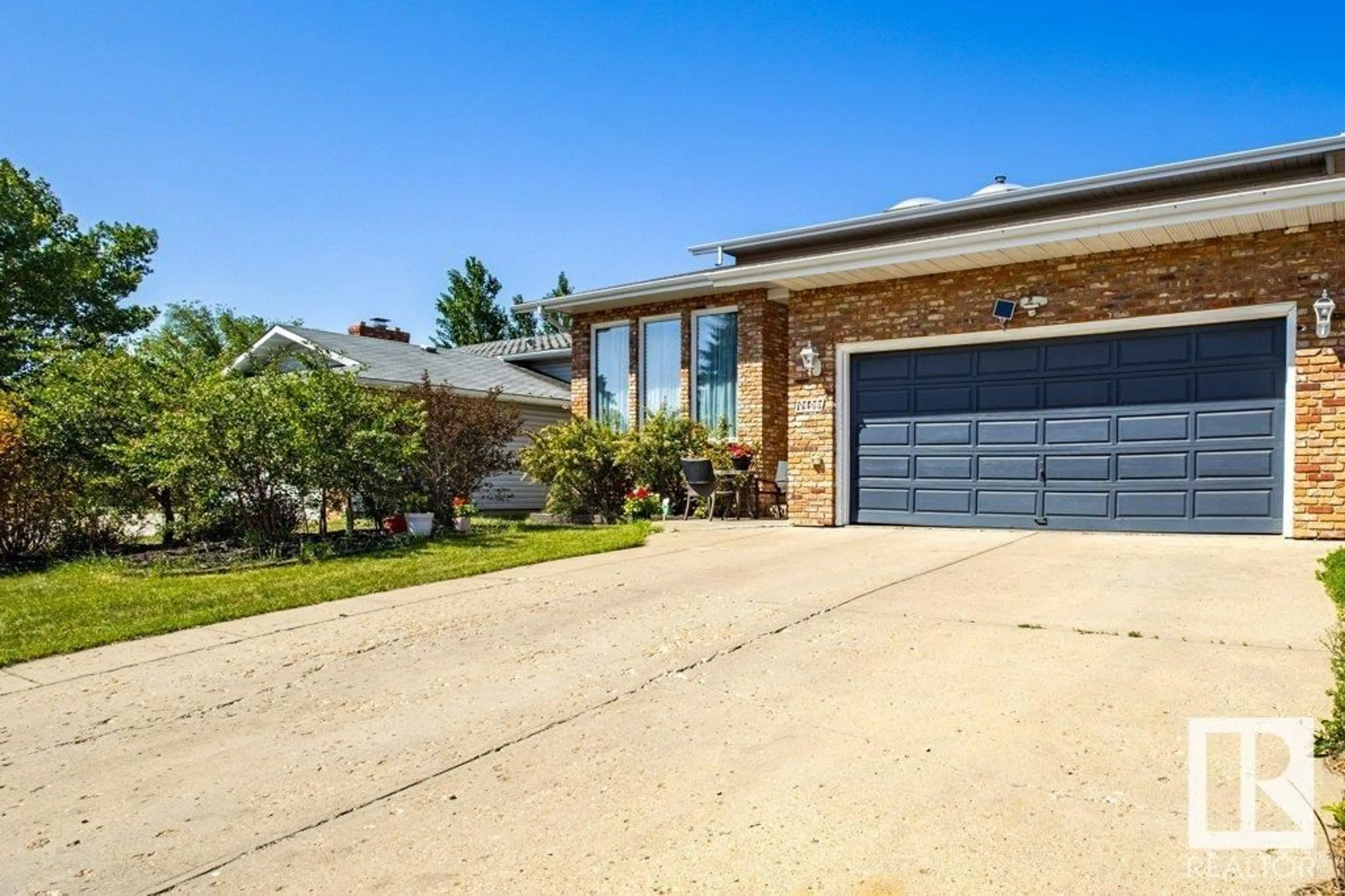 Home with brick exterior material, street for NW - 2108 104B ST, Edmonton Alberta T6J5G8