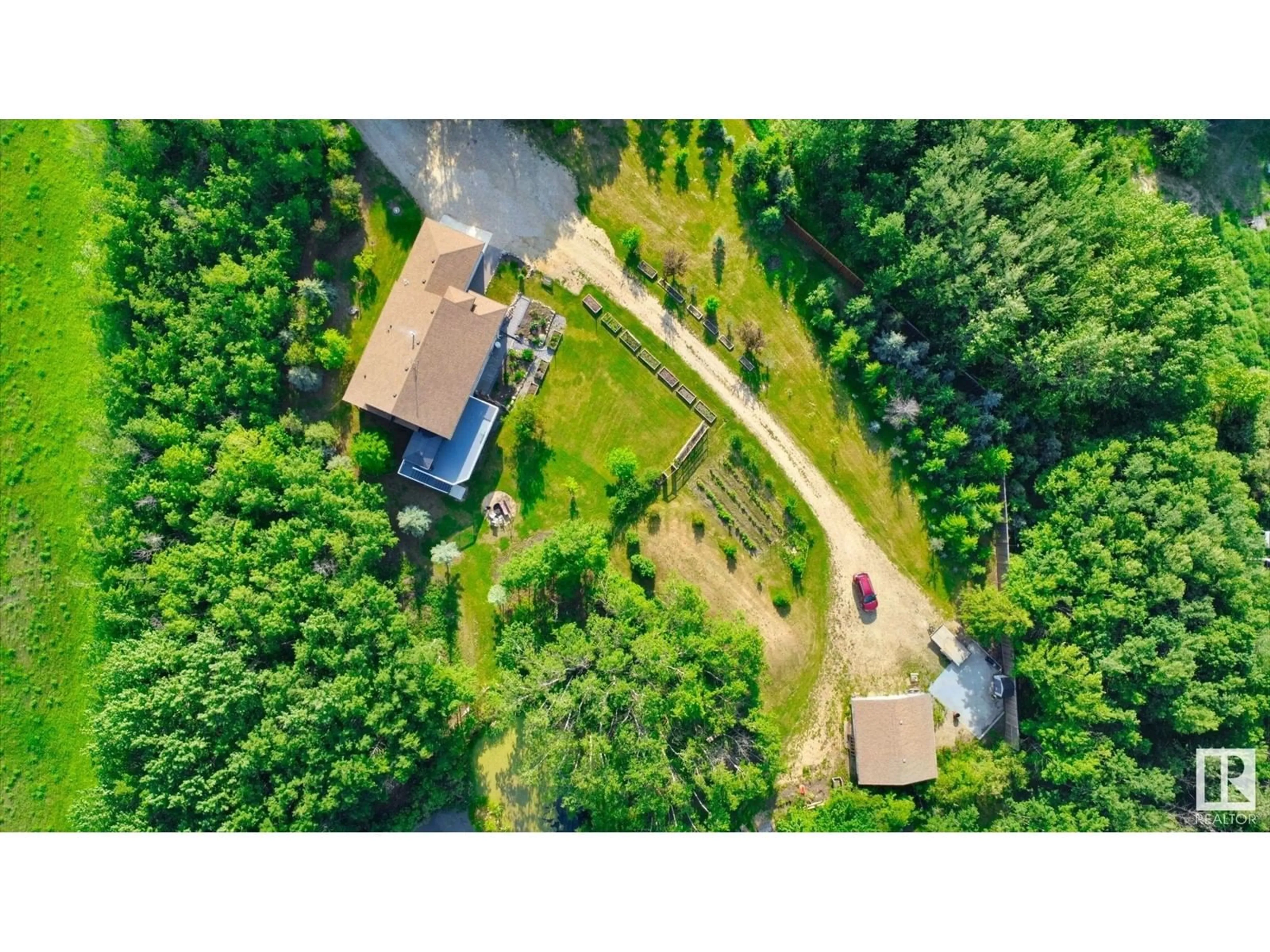 A pic from outside/outdoor area/front of a property/back of a property/a pic from drone, forest/trees view for 50240 RGE RD 225, Rural Leduc County Alberta T0B3M1