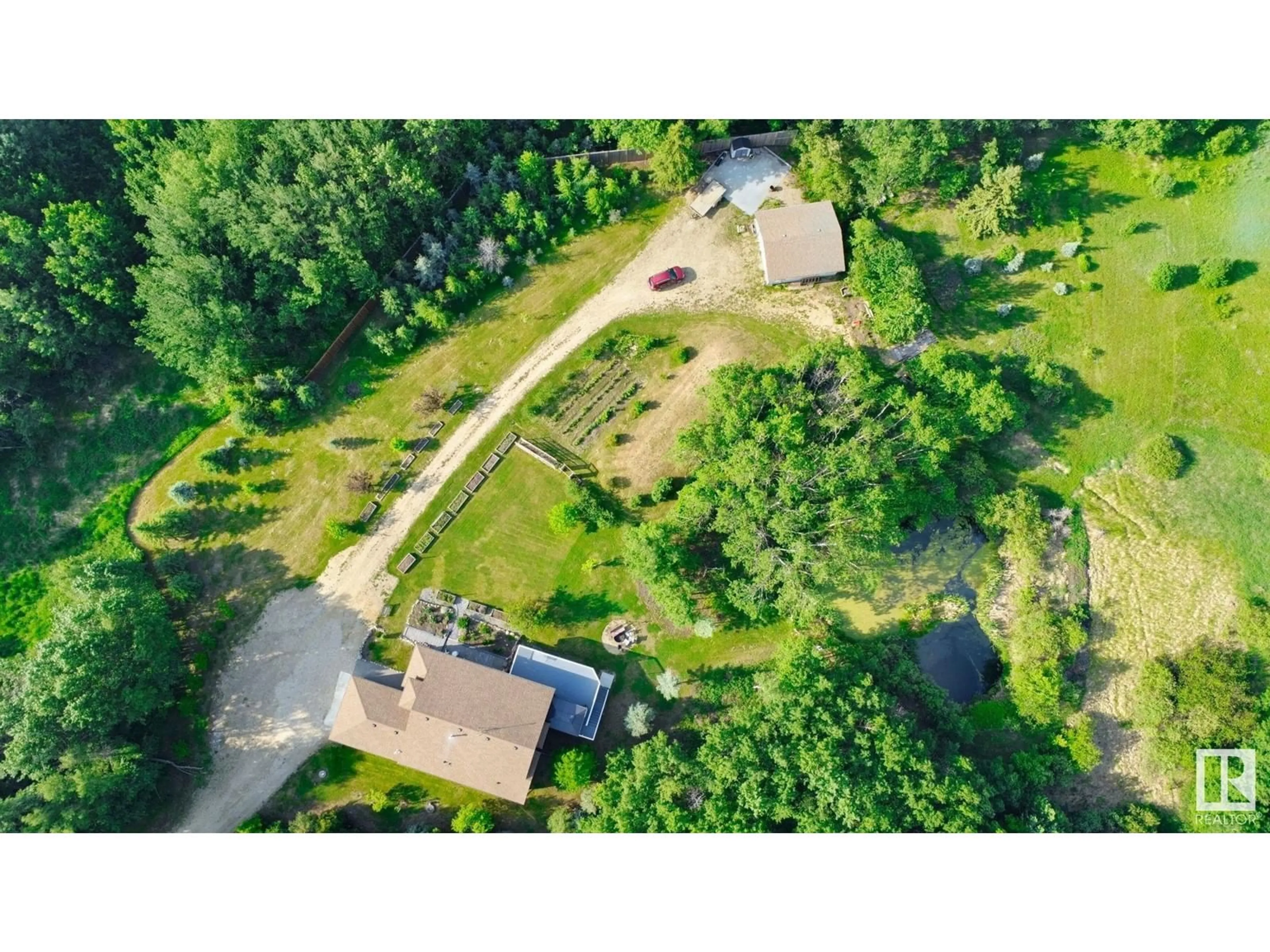 A pic from outside/outdoor area/front of a property/back of a property/a pic from drone, forest/trees view for 50240 RGE RD 225, Rural Leduc County Alberta T0B3M1