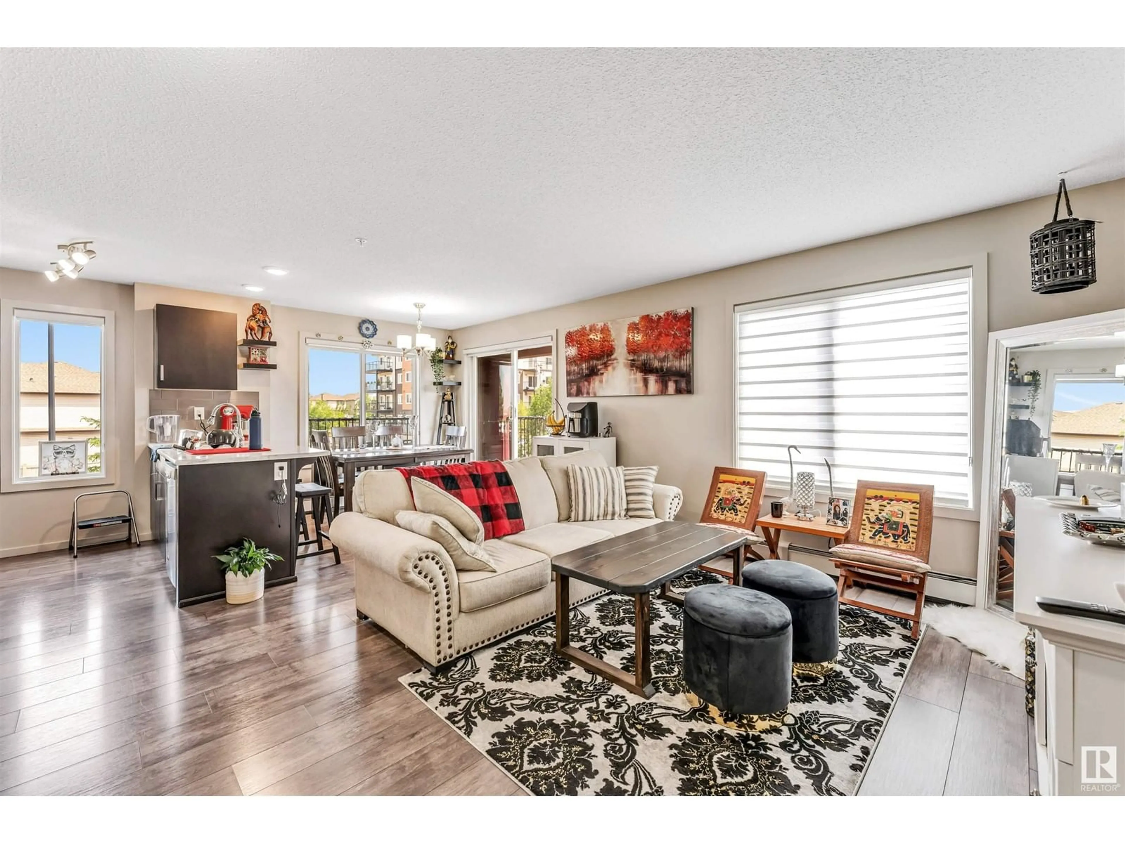 Living room with furniture, wood/laminate floor for 220 - 220 5515 7 AVENUE AVENUE, Edmonton Alberta T6X2A8