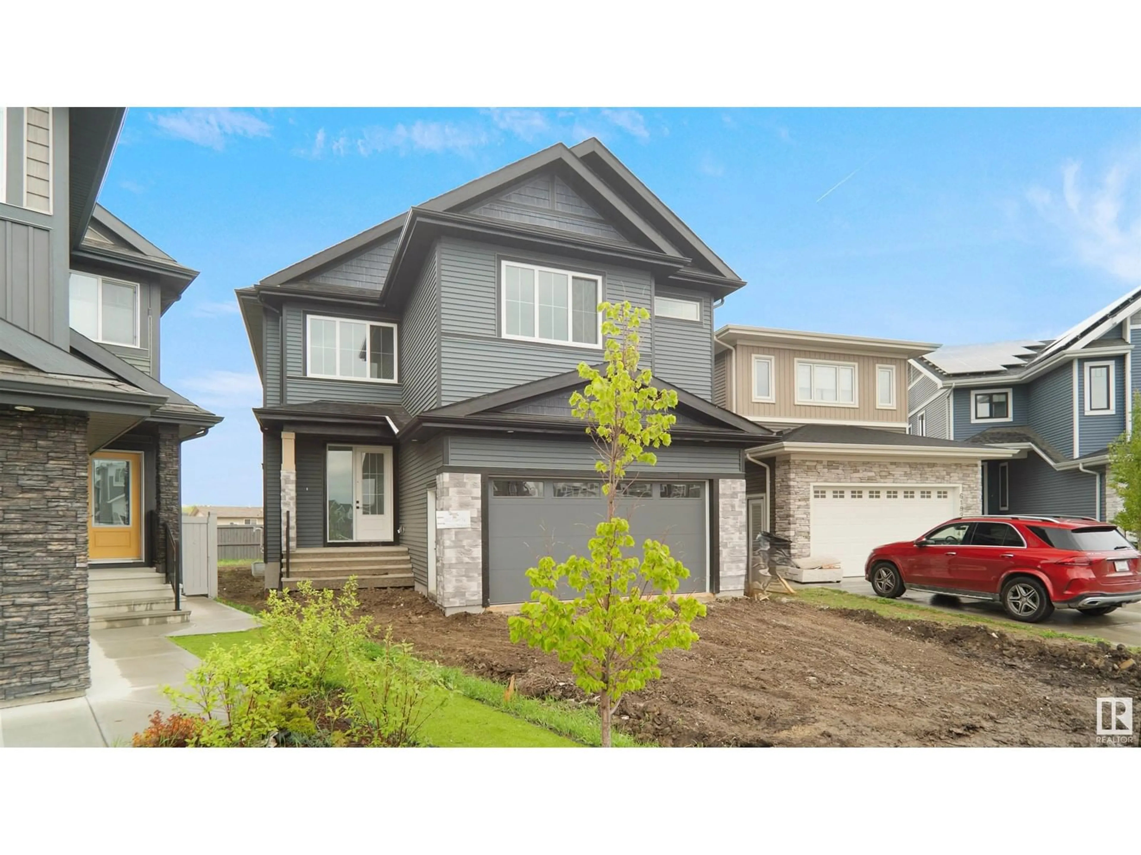 Home with vinyl exterior material, street for 6187 CARR RD, Edmonton Alberta T5E6Y5