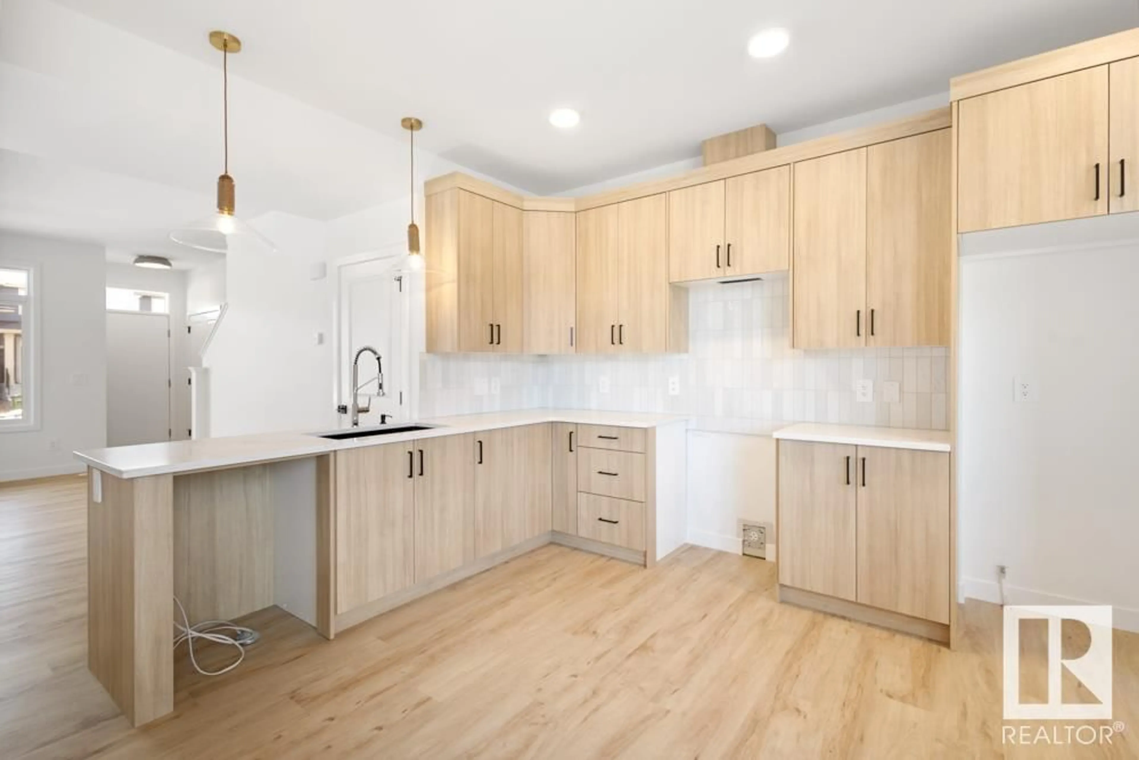 Open concept kitchen, wood/laminate floor for 1343 KESWICK DR, Edmonton Alberta T6W4V8