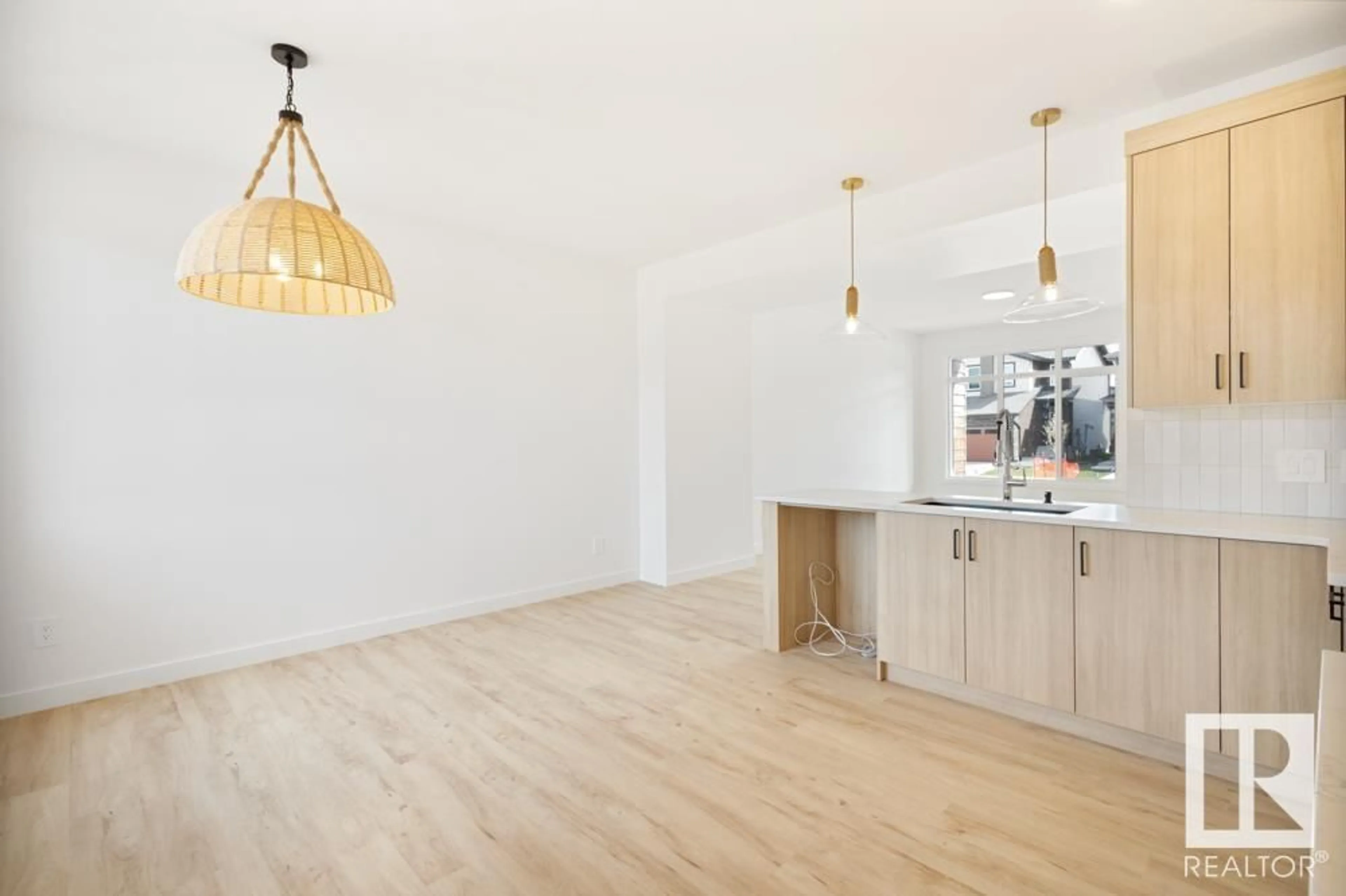 Open concept kitchen, wood/laminate floor for 1343 KESWICK DR, Edmonton Alberta T6W4V8
