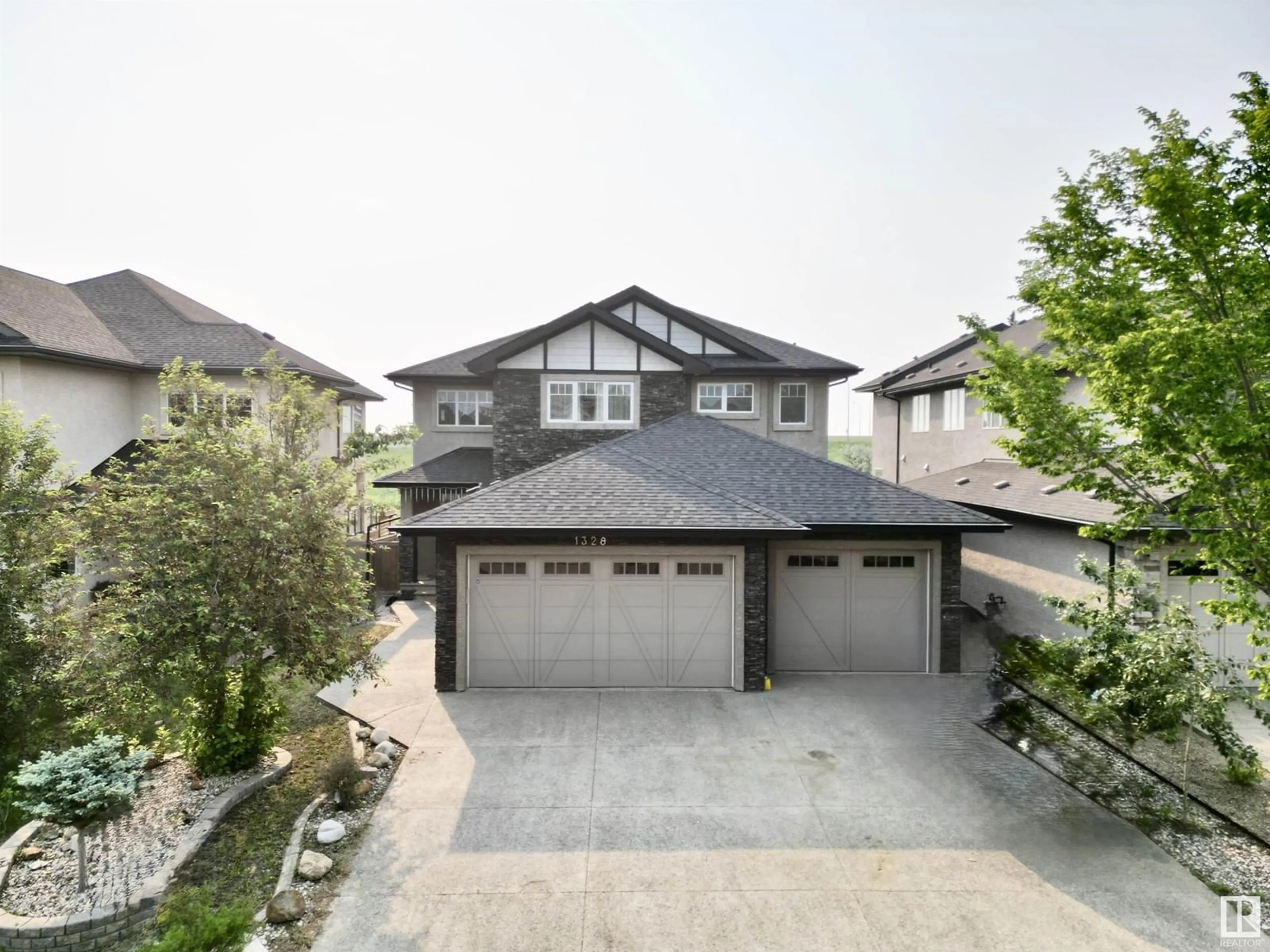 A pic from outside/outdoor area/front of a property/back of a property/a pic from drone, street for 1328 ADAMSON DR, Edmonton Alberta T6W1A8