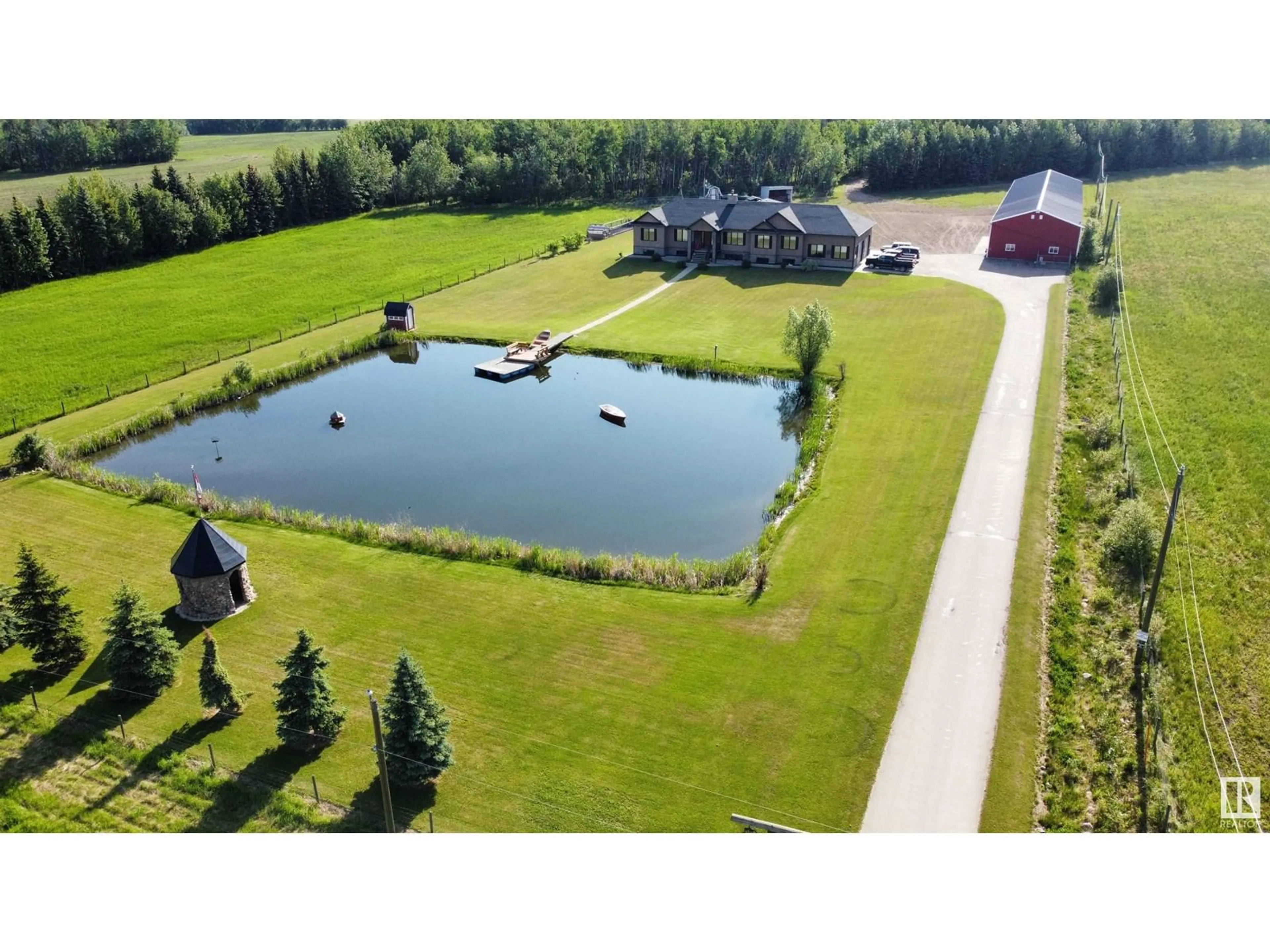 A pic from outside/outdoor area/front of a property/back of a property/a pic from drone, water/lake/river/ocean view for 665033 RGE RD 181, Rural Athabasca County Alberta T0A0E0
