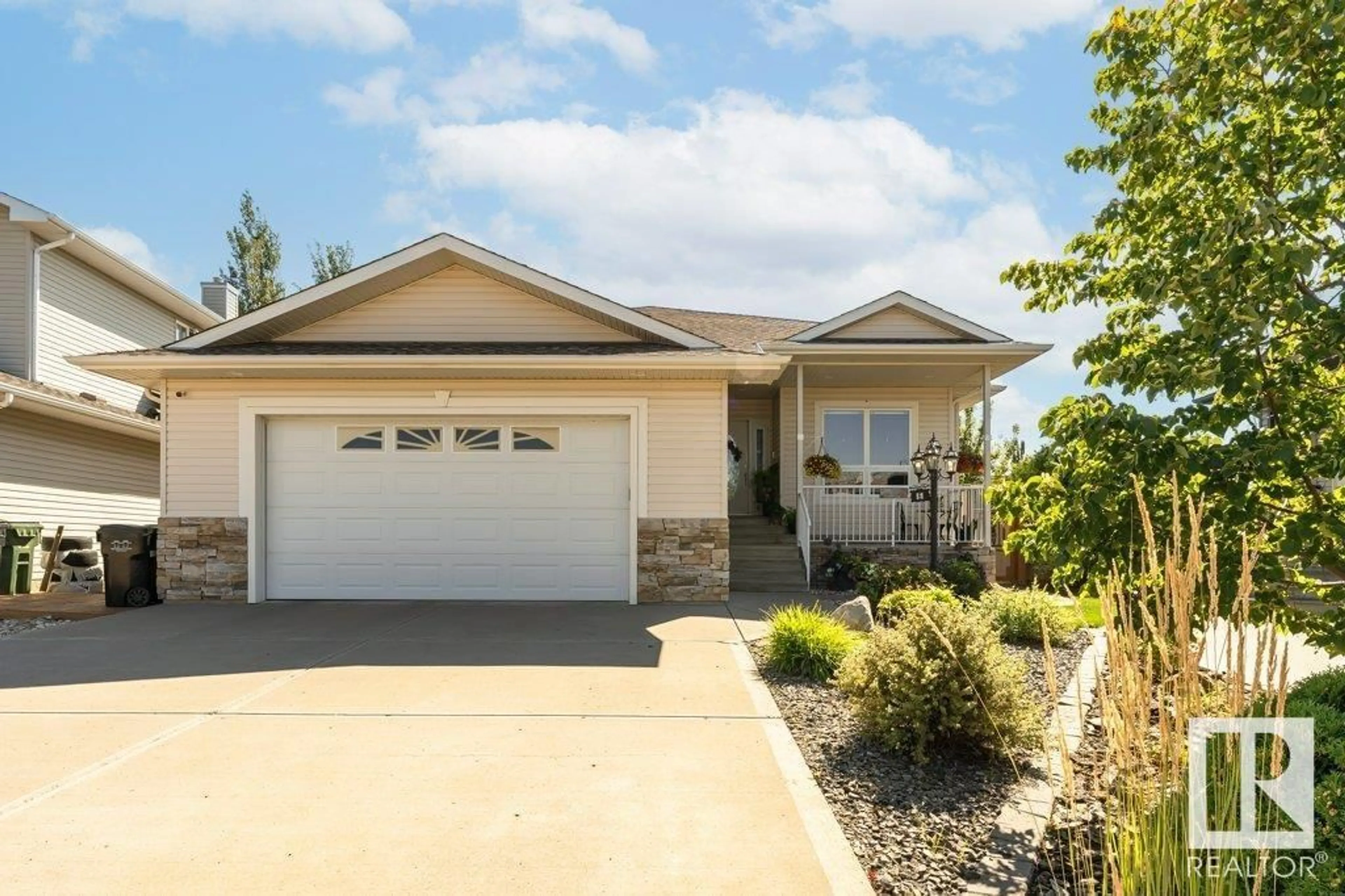 Home with vinyl exterior material, street for 6 WOODS, Leduc Alberta T9E8K3