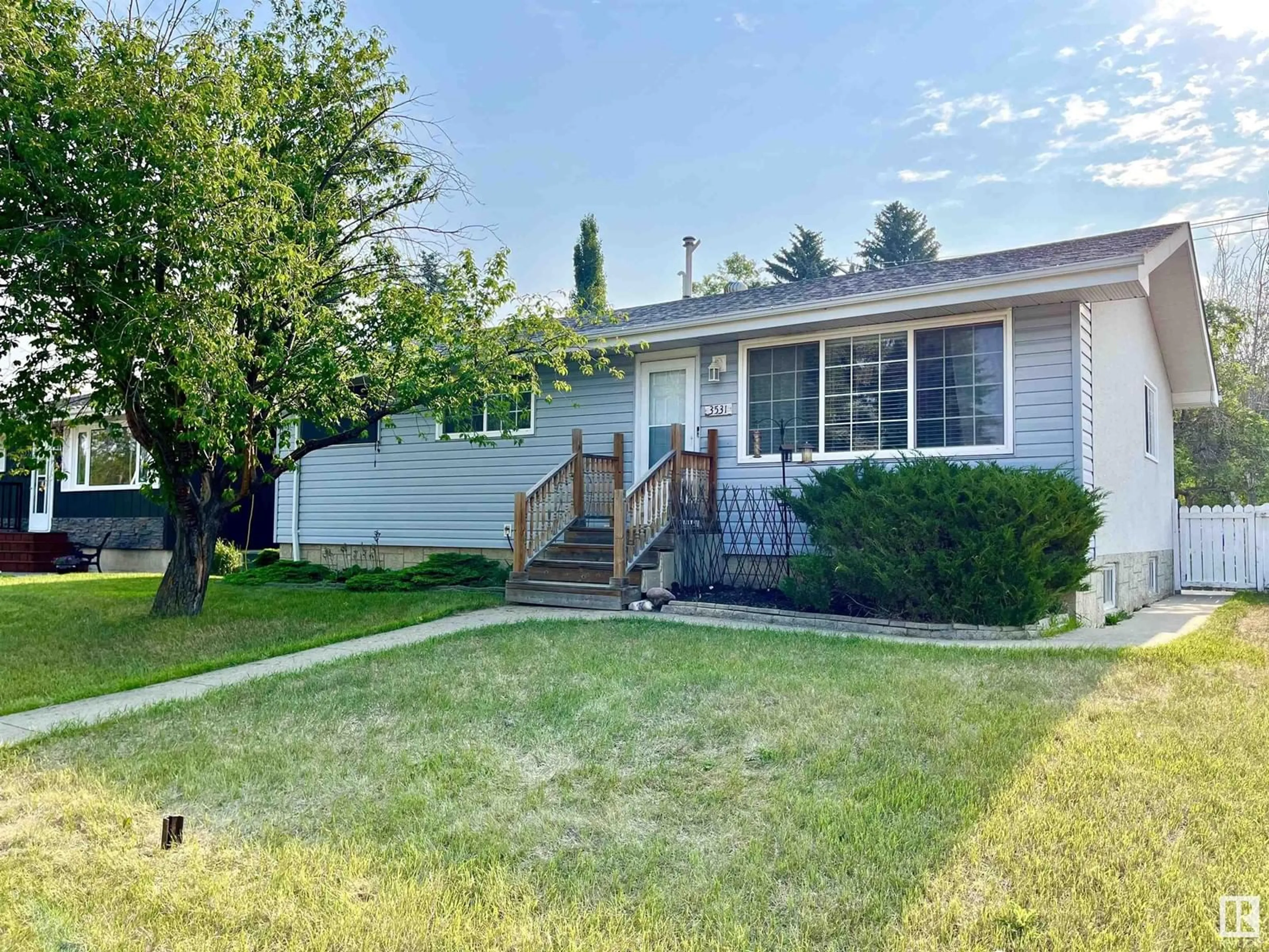 Home with vinyl exterior material, street for 3531 114 ST, Edmonton Alberta T6J1L7