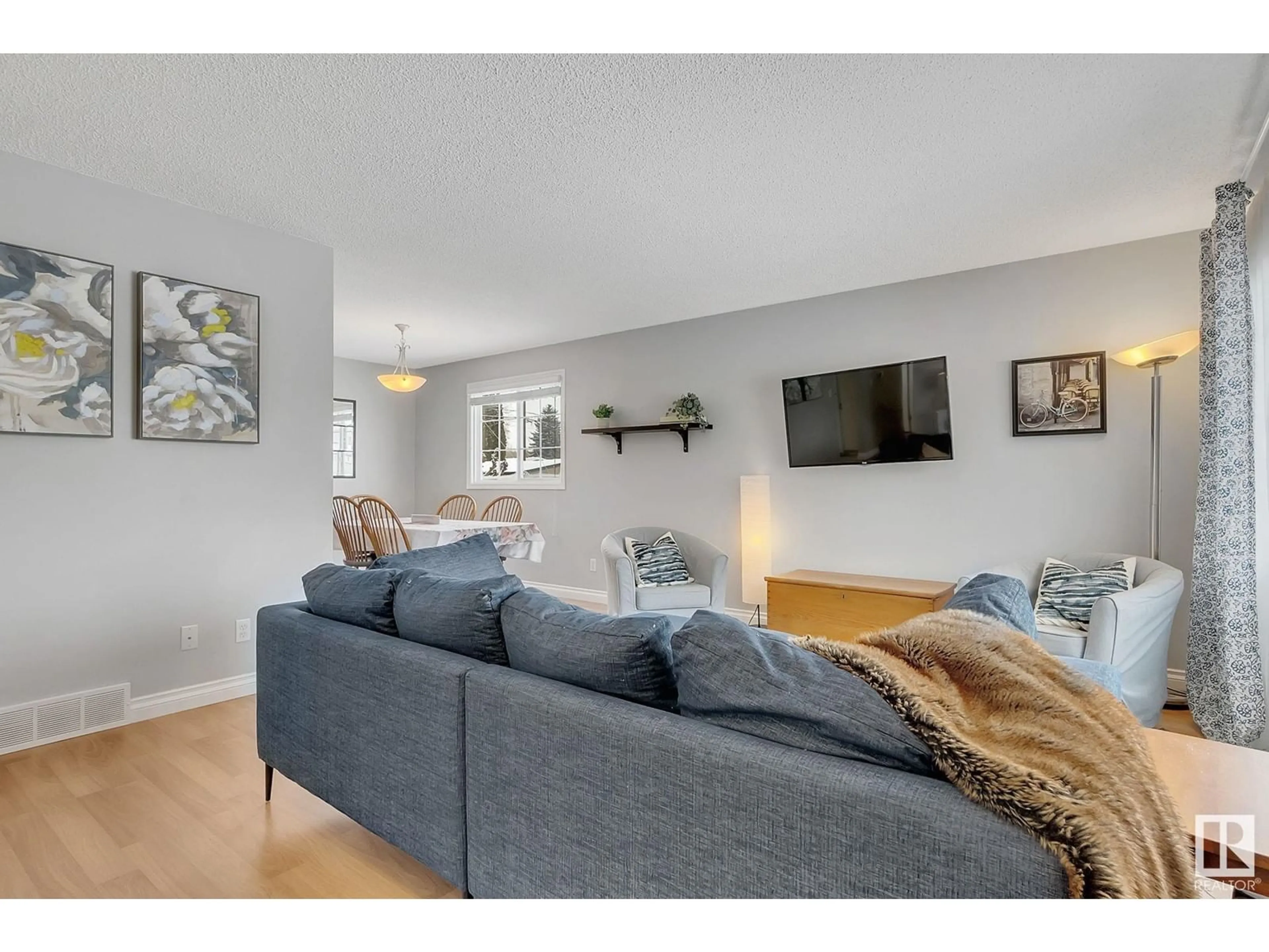 Living room with furniture, wood/laminate floor for 3531 114 ST, Edmonton Alberta T6J1L7