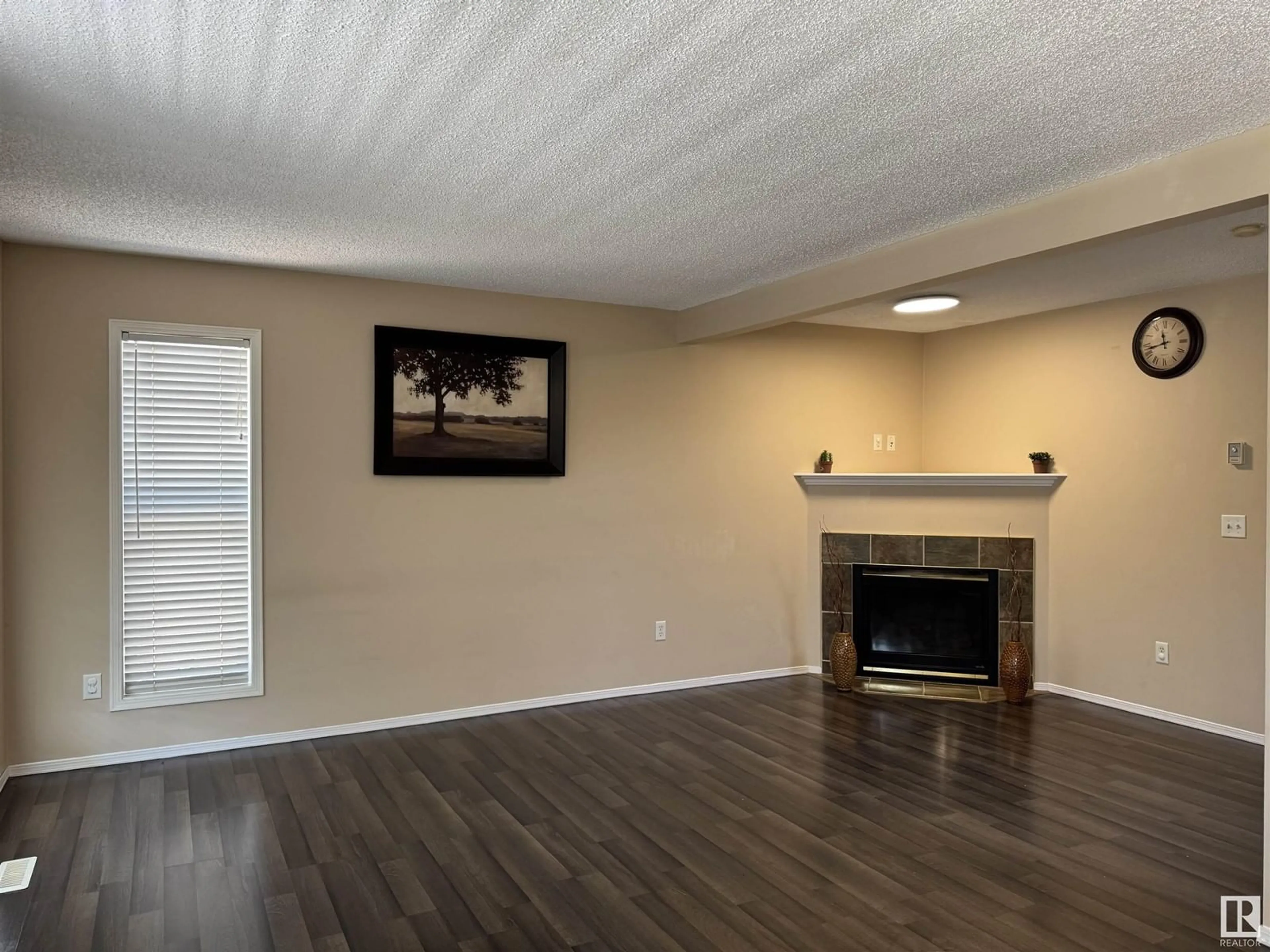 Living room with furniture, wood/laminate floor for 14004 156 AV, Edmonton Alberta T6V1T3