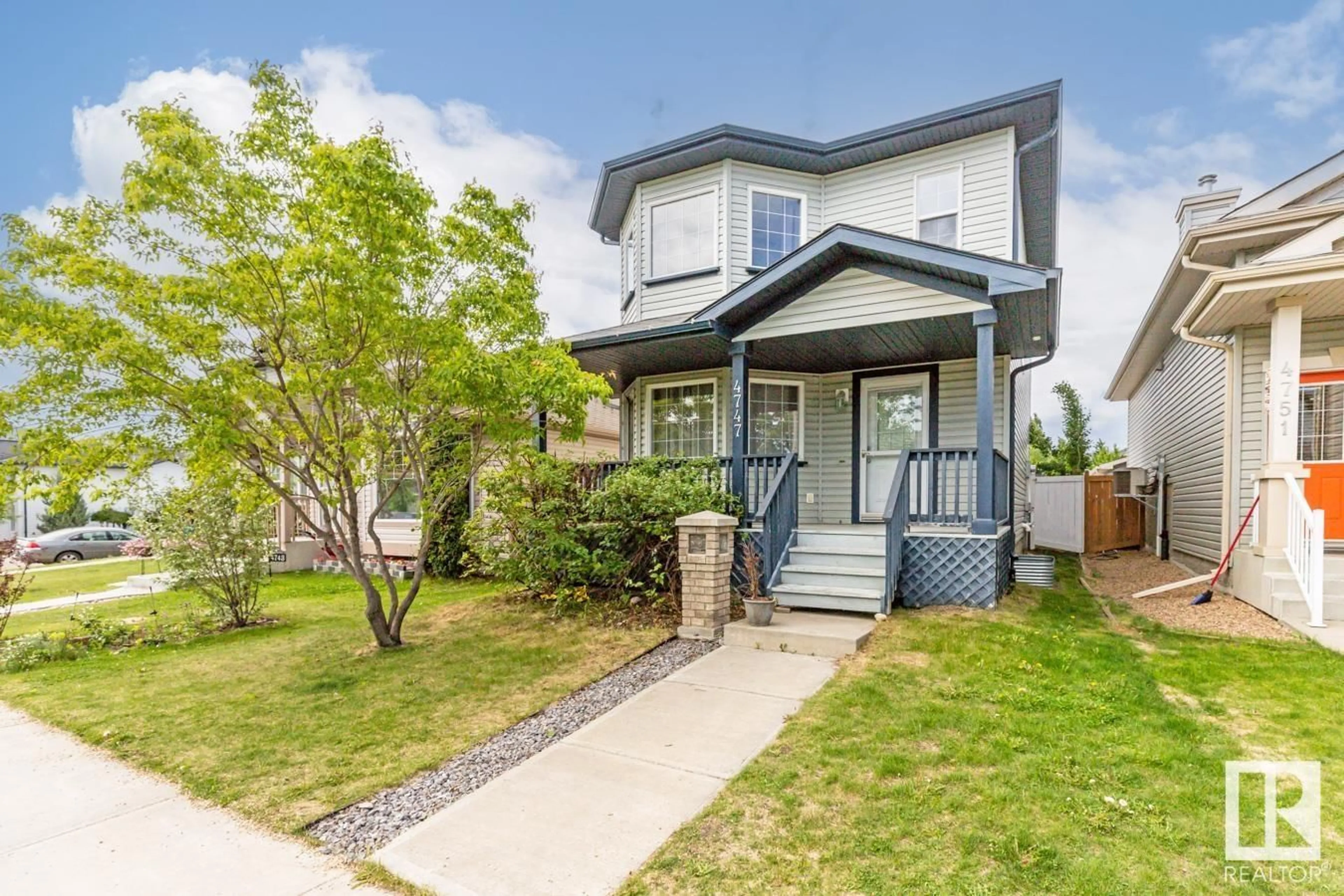 Home with vinyl exterior material, street for 4747 156 AV, Edmonton Alberta T5Y0B6