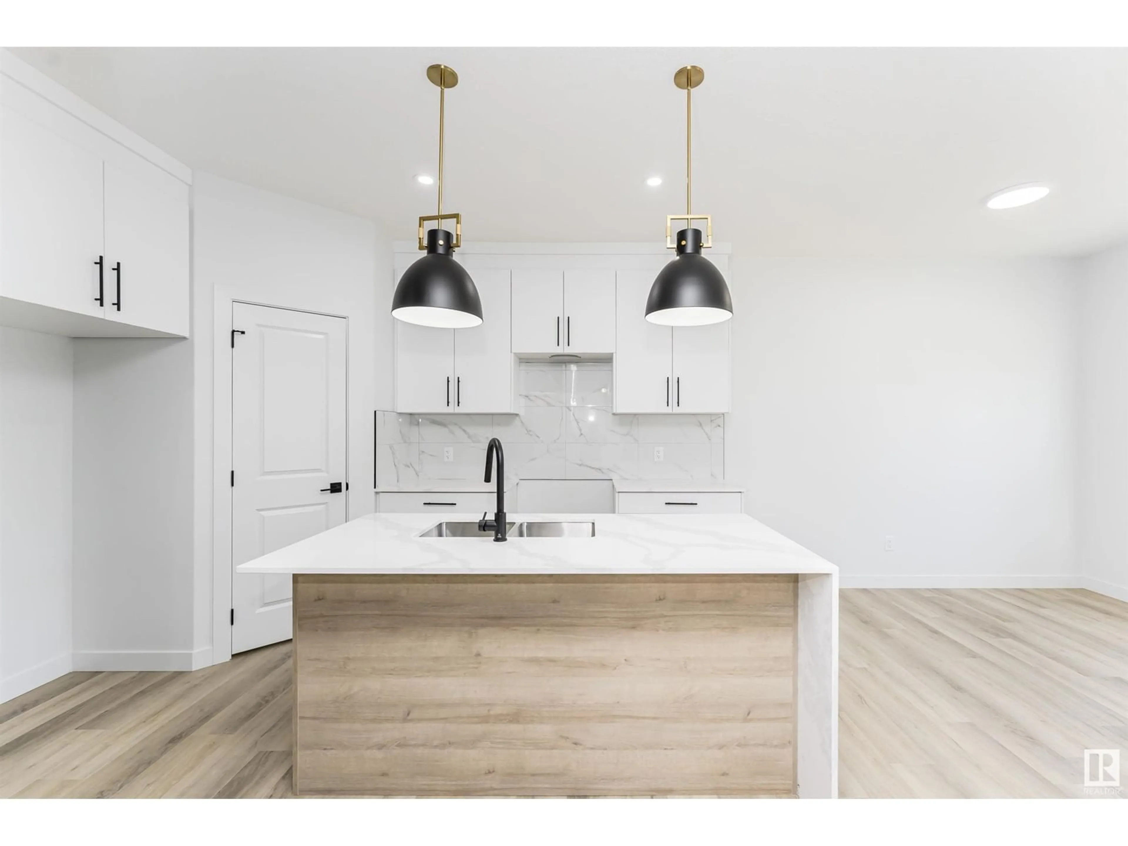 Open concept kitchen, wood/laminate floor for NW - 8723 181 AV, Edmonton Alberta T5Z0X2