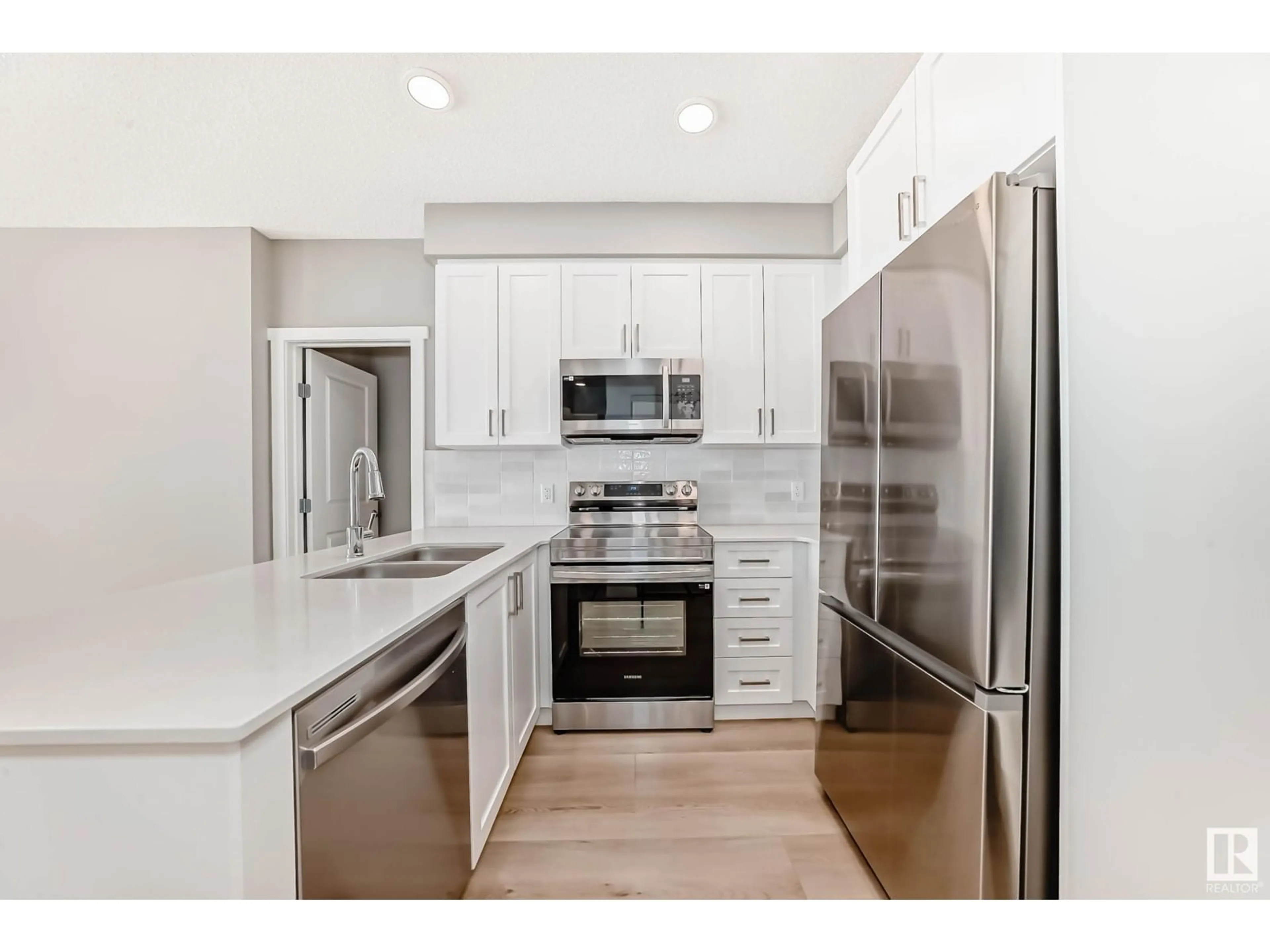 Open concept kitchen, unknown for #221 - 12804 140 AV, Edmonton Alberta T6V1K4