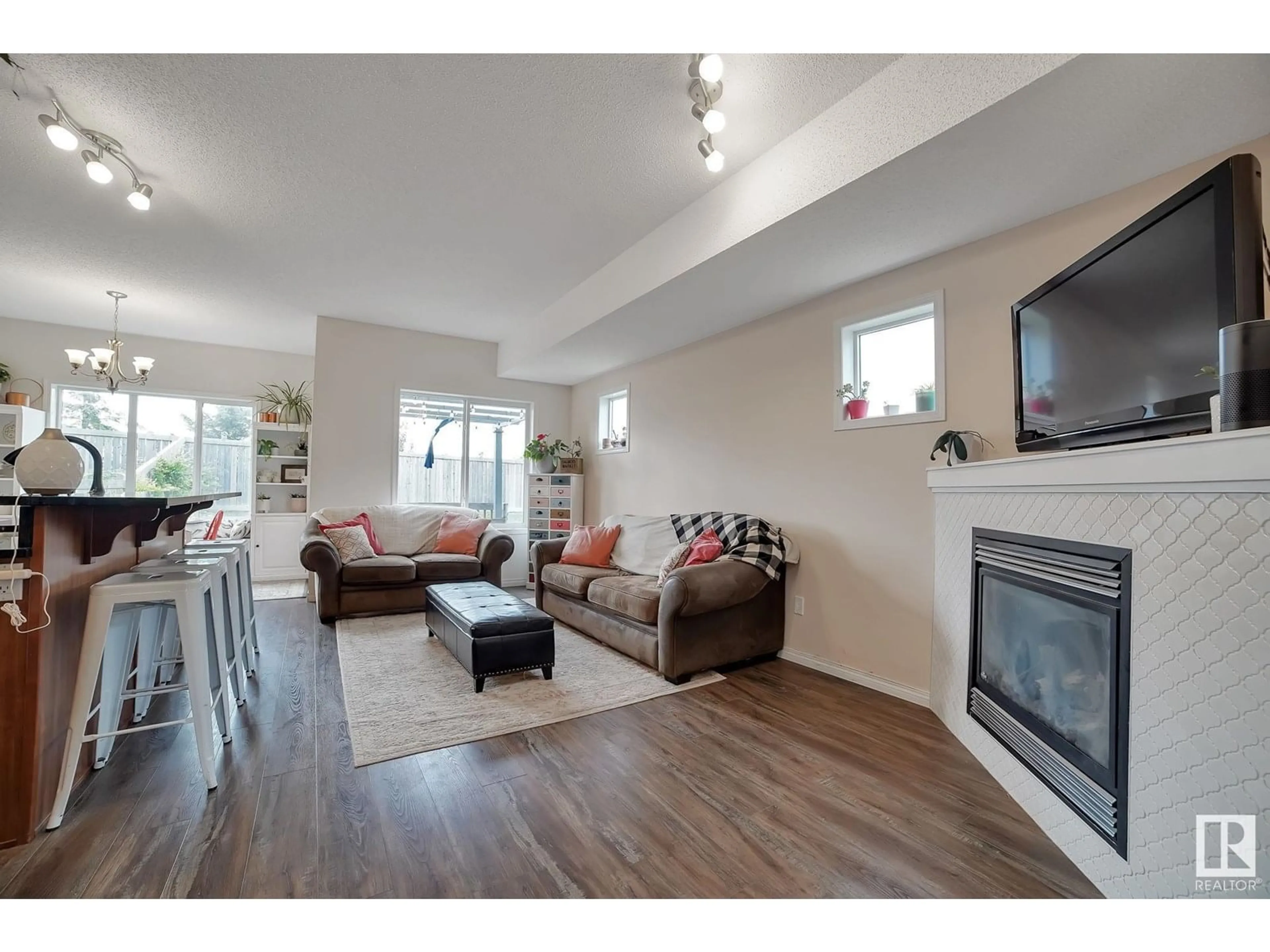 Living room with furniture, wood/laminate floor for 50 HARTWICK MR, Spruce Grove Alberta T7X0L8