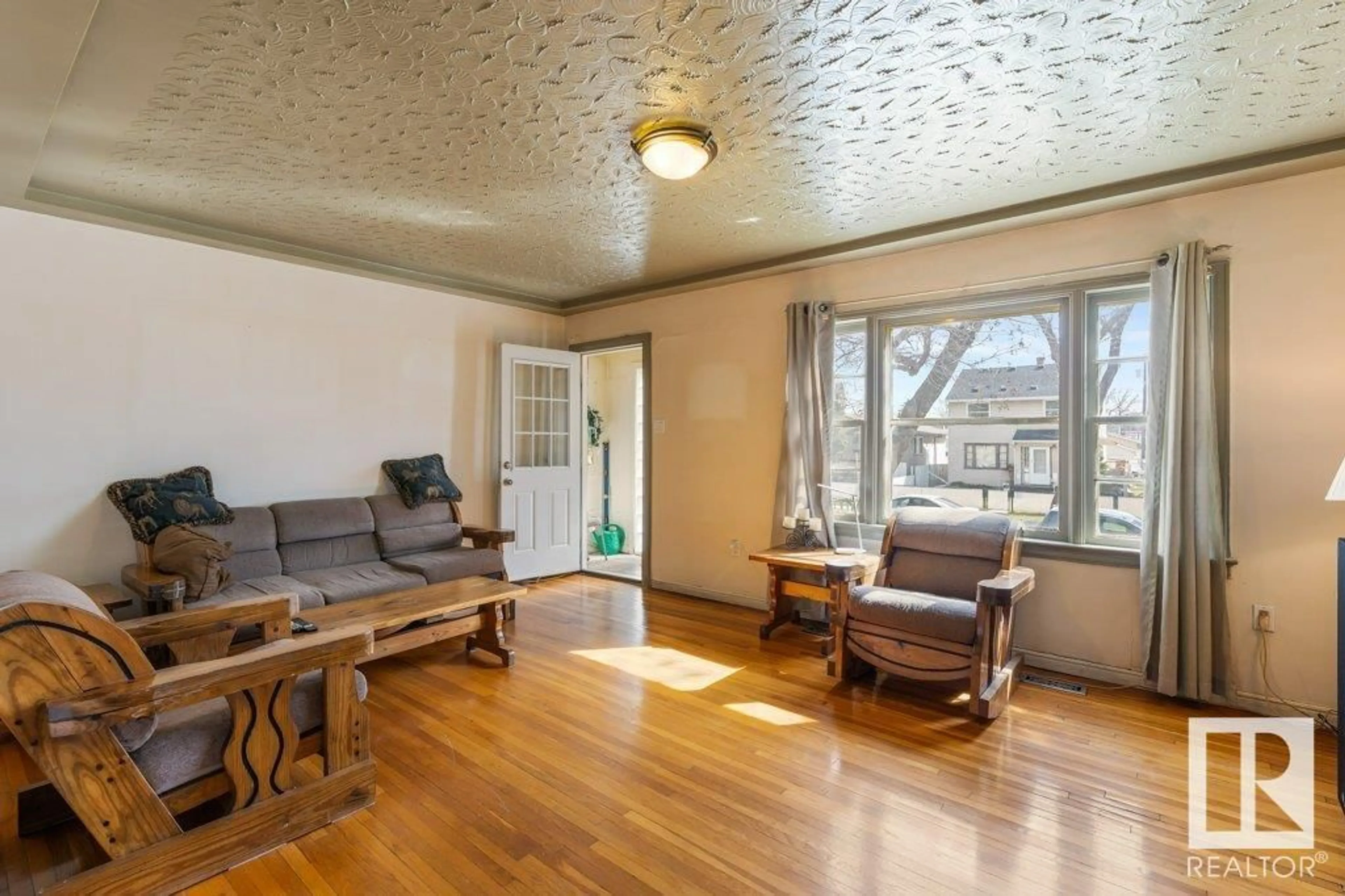 Living room with furniture, wood/laminate floor for NW - 12610 69 ST, Edmonton Alberta T5C0G8