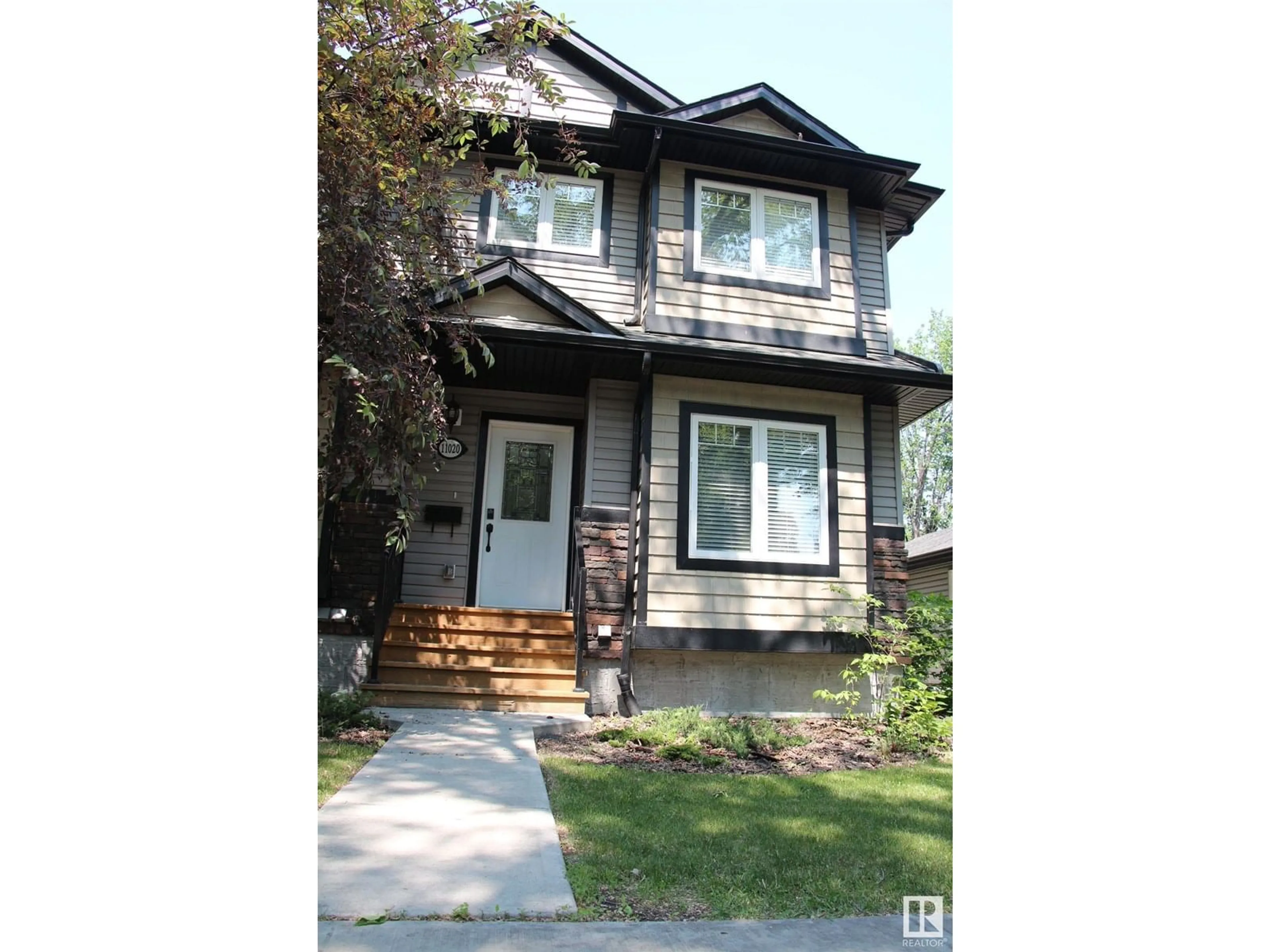 Home with vinyl exterior material, street for 11020 108 AV, Edmonton Alberta T5H3G4