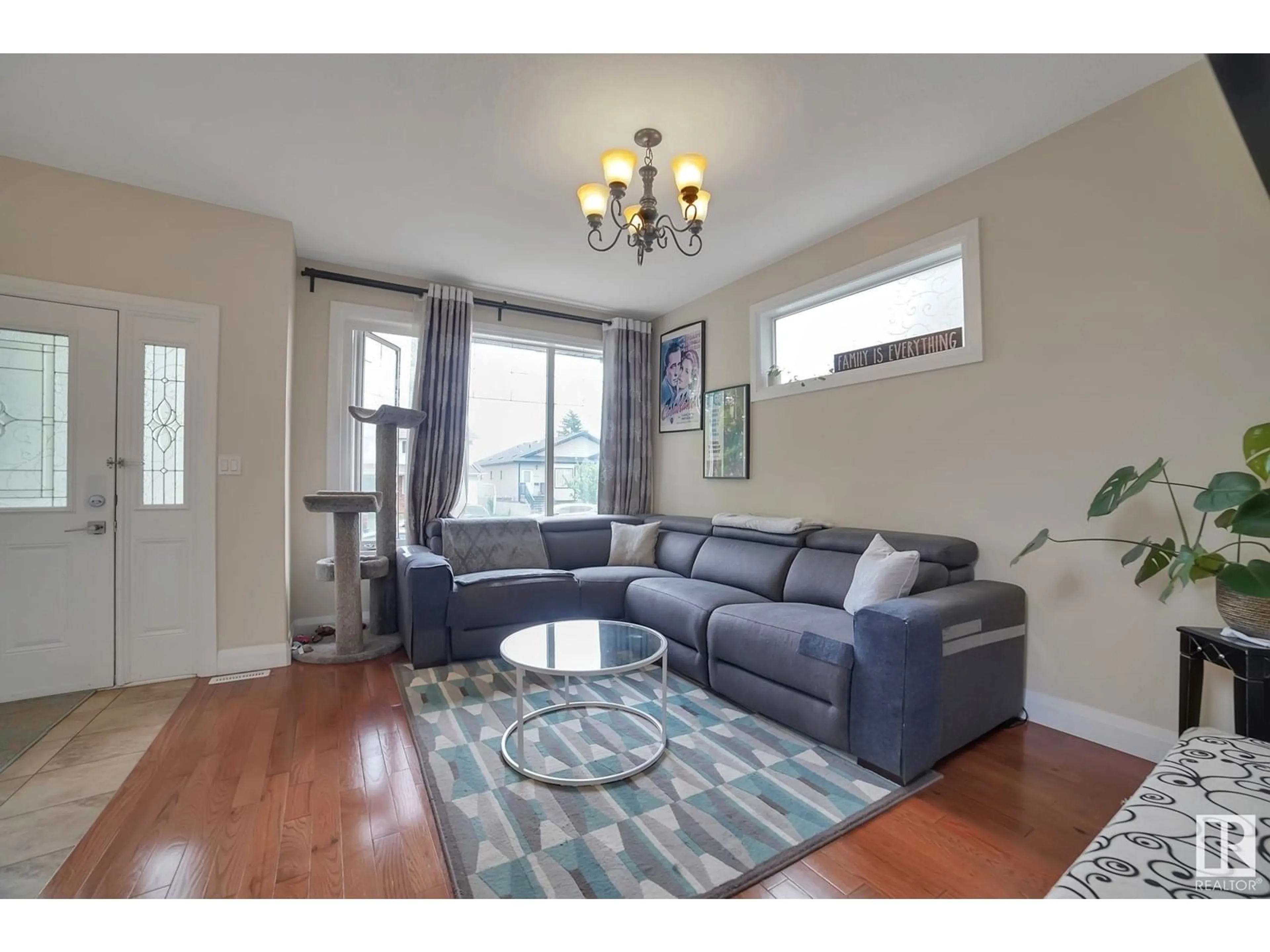 Living room with furniture, wood/laminate floor for NW - 10262 158 ST, Edmonton Alberta T5P2Y1