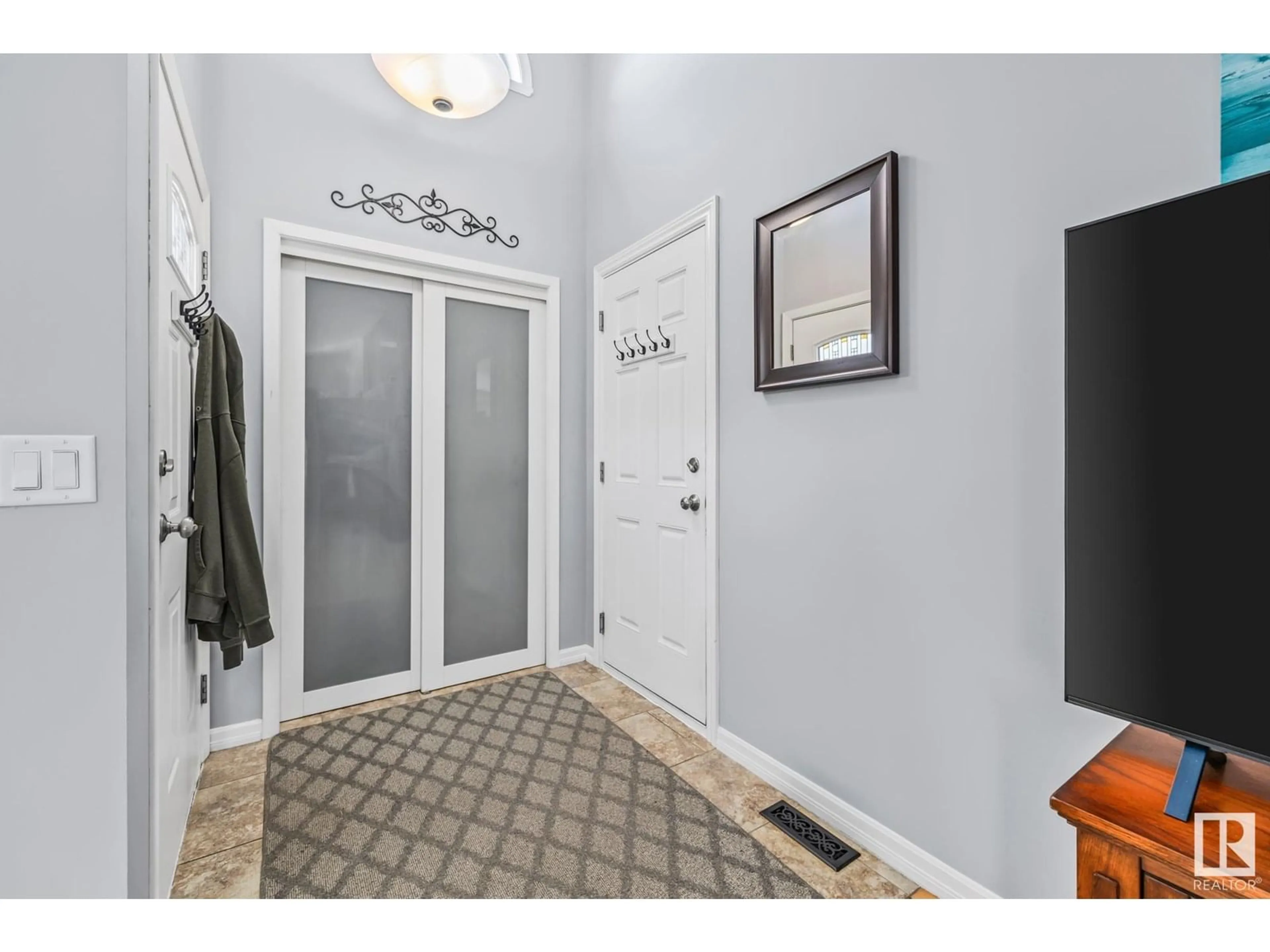 Living room with furniture, wood/laminate floor for 21 DUNDAS PL, St. Albert Alberta T8N6C9