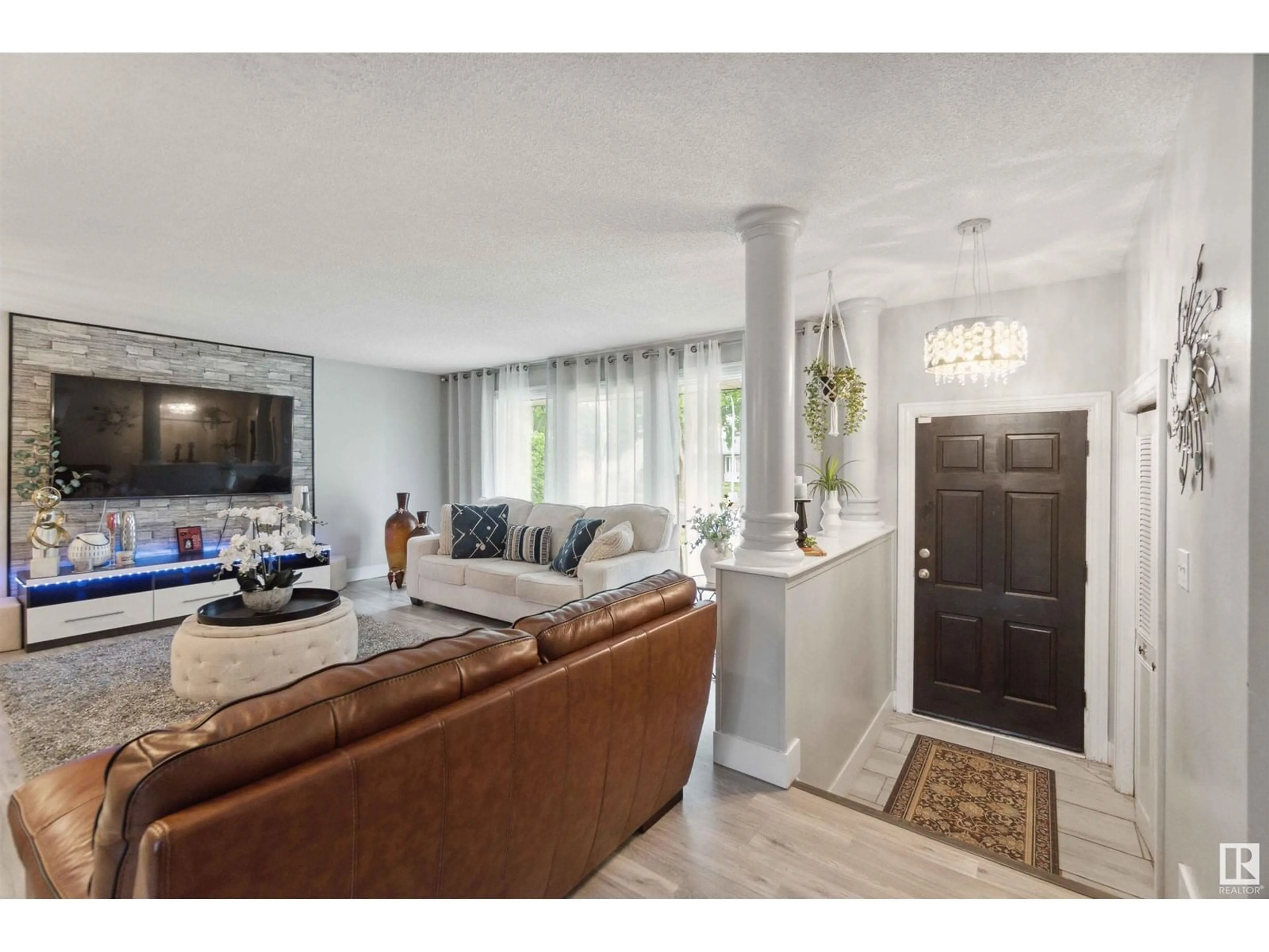 Living room with furniture, unknown for 11439 145 AV, Edmonton Alberta T5X1M1