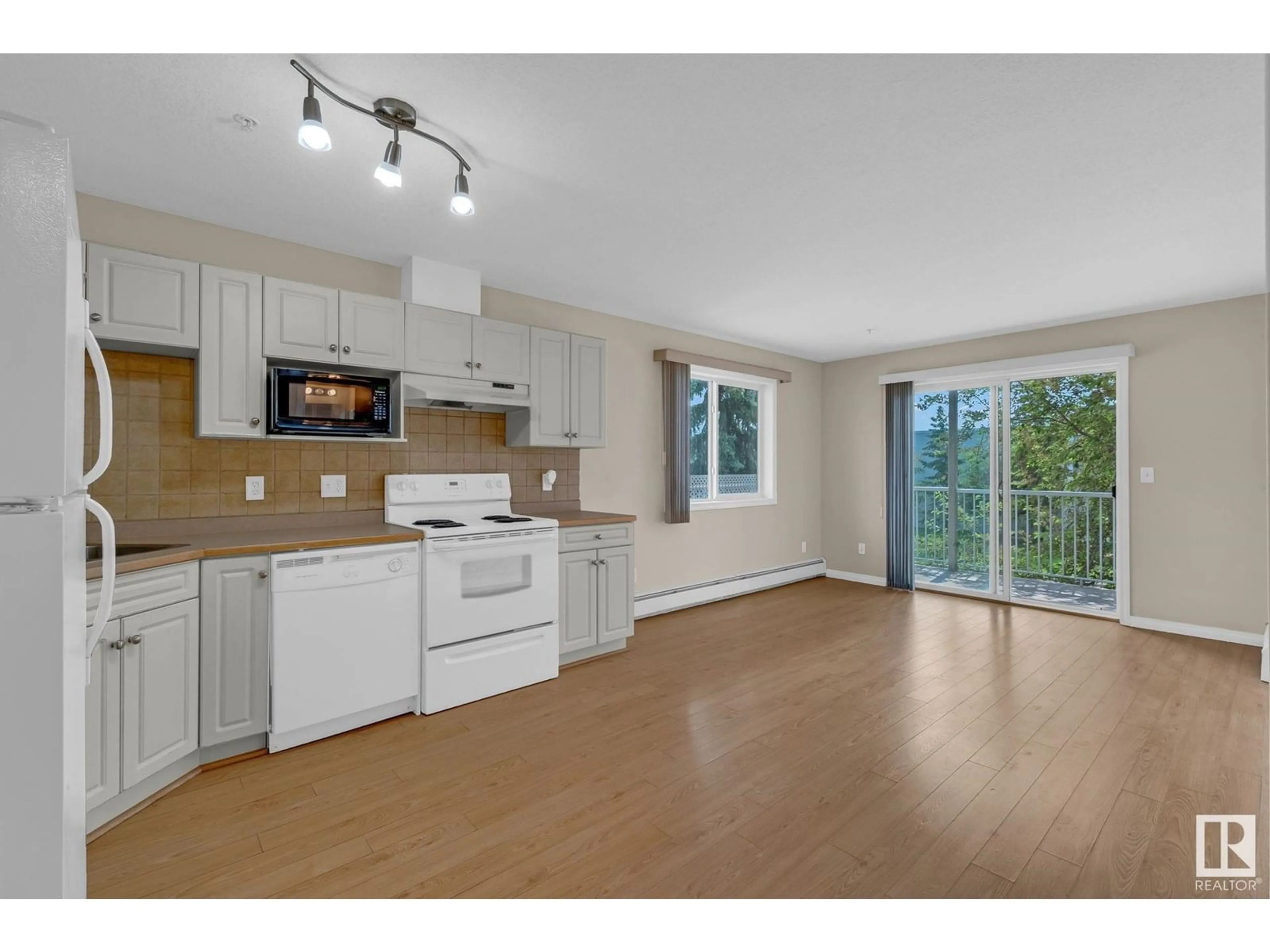 Open concept kitchen, unknown for #212 - 12550 140 AV, Edmonton Alberta T5X6J4