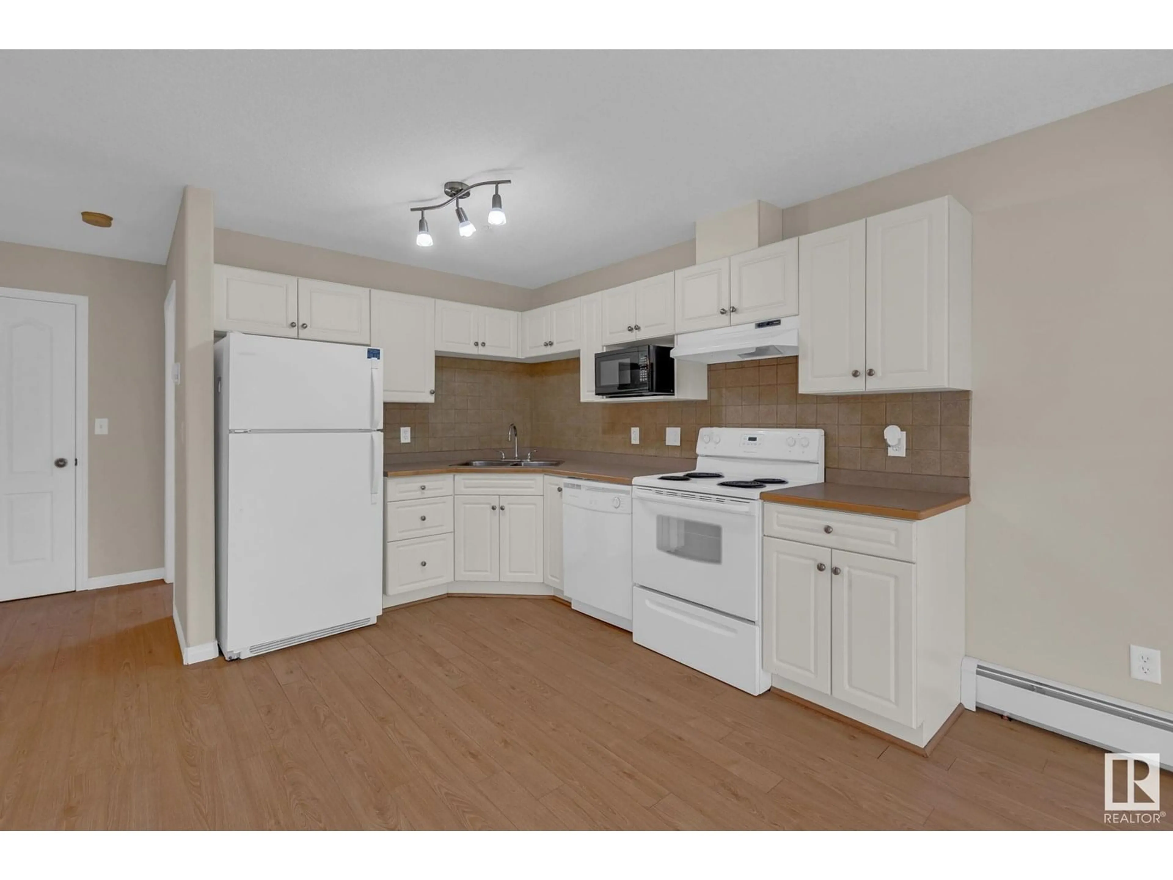 Standard kitchen, wood/laminate floor for #212 - 12550 140 AV, Edmonton Alberta T5X6J4