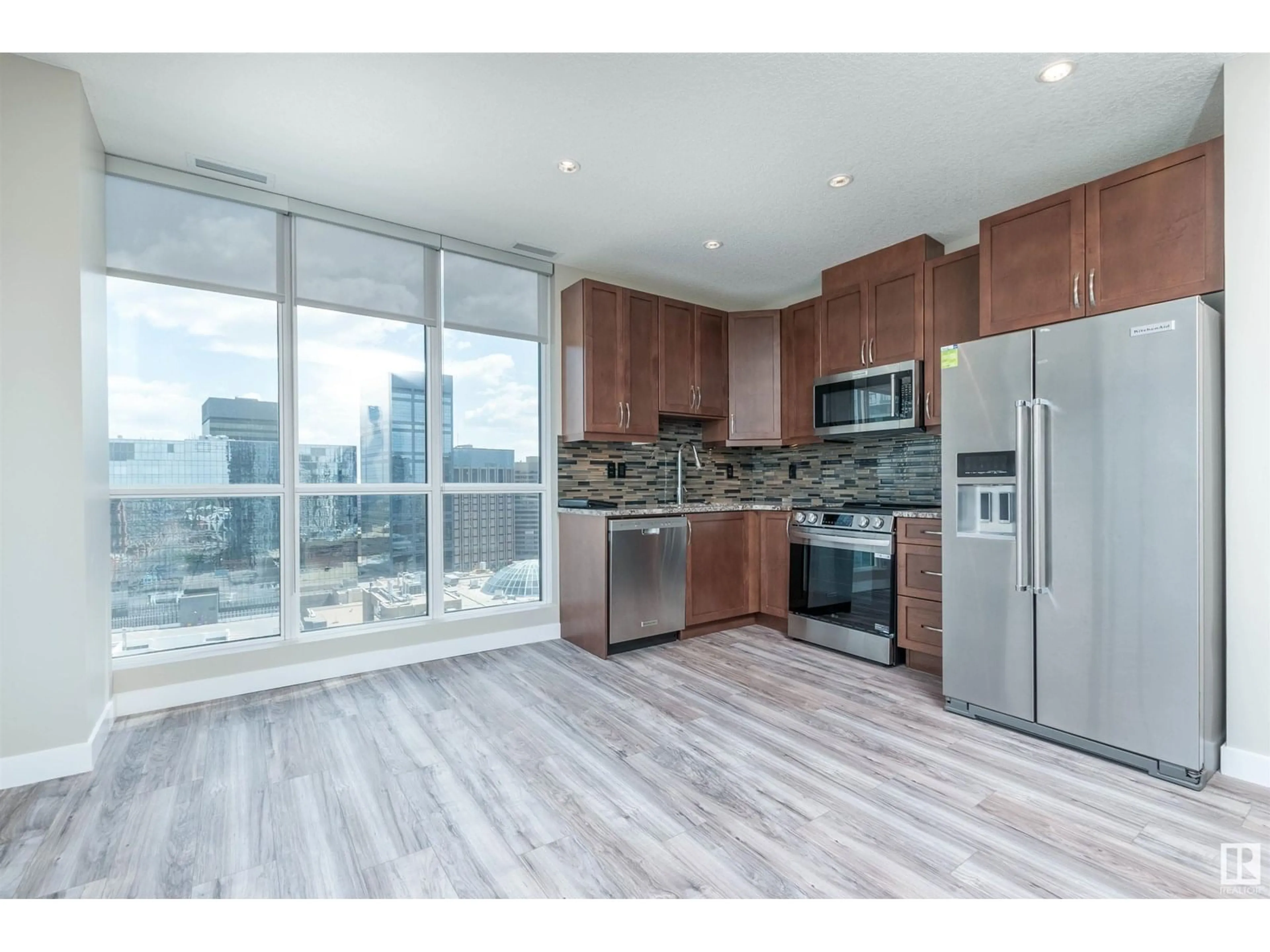Open concept kitchen, wood/laminate floor for 1903 10283 ST NW, Edmonton Alberta T5J0G6