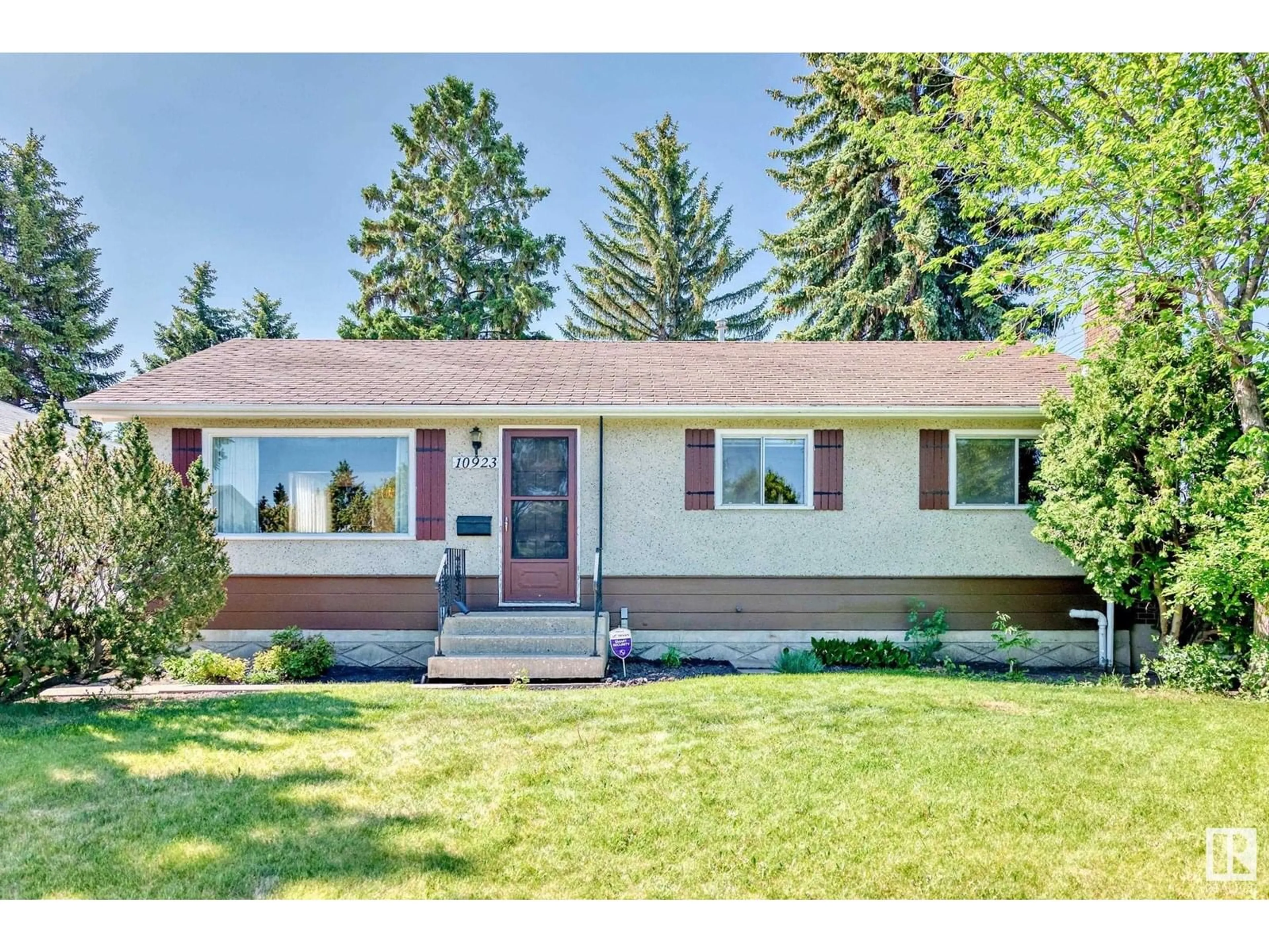 Home with vinyl exterior material, street for 10923 135A AV, Edmonton Alberta T5E1T2