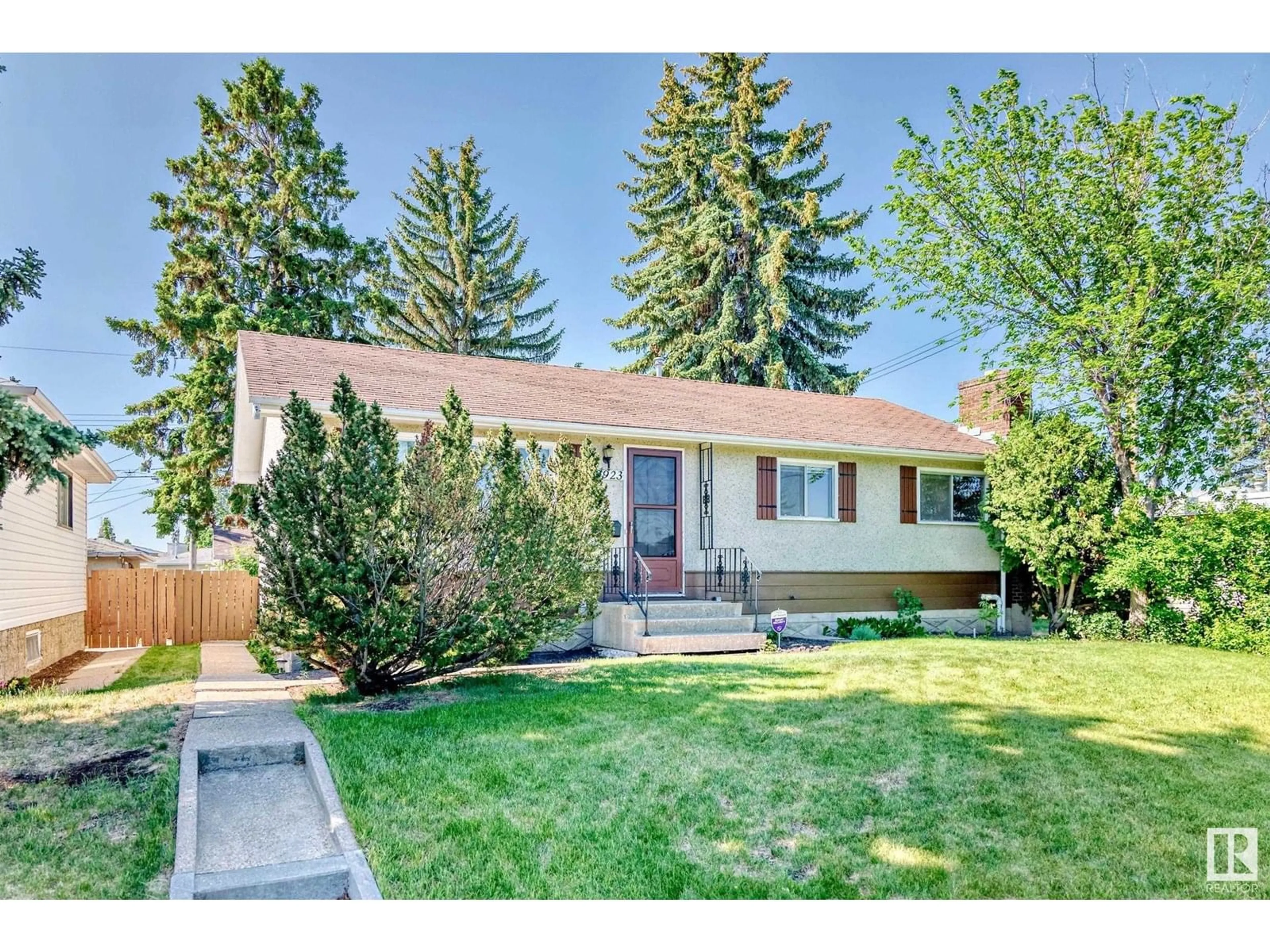 Home with vinyl exterior material, street for 10923 135A AV, Edmonton Alberta T5E1T2
