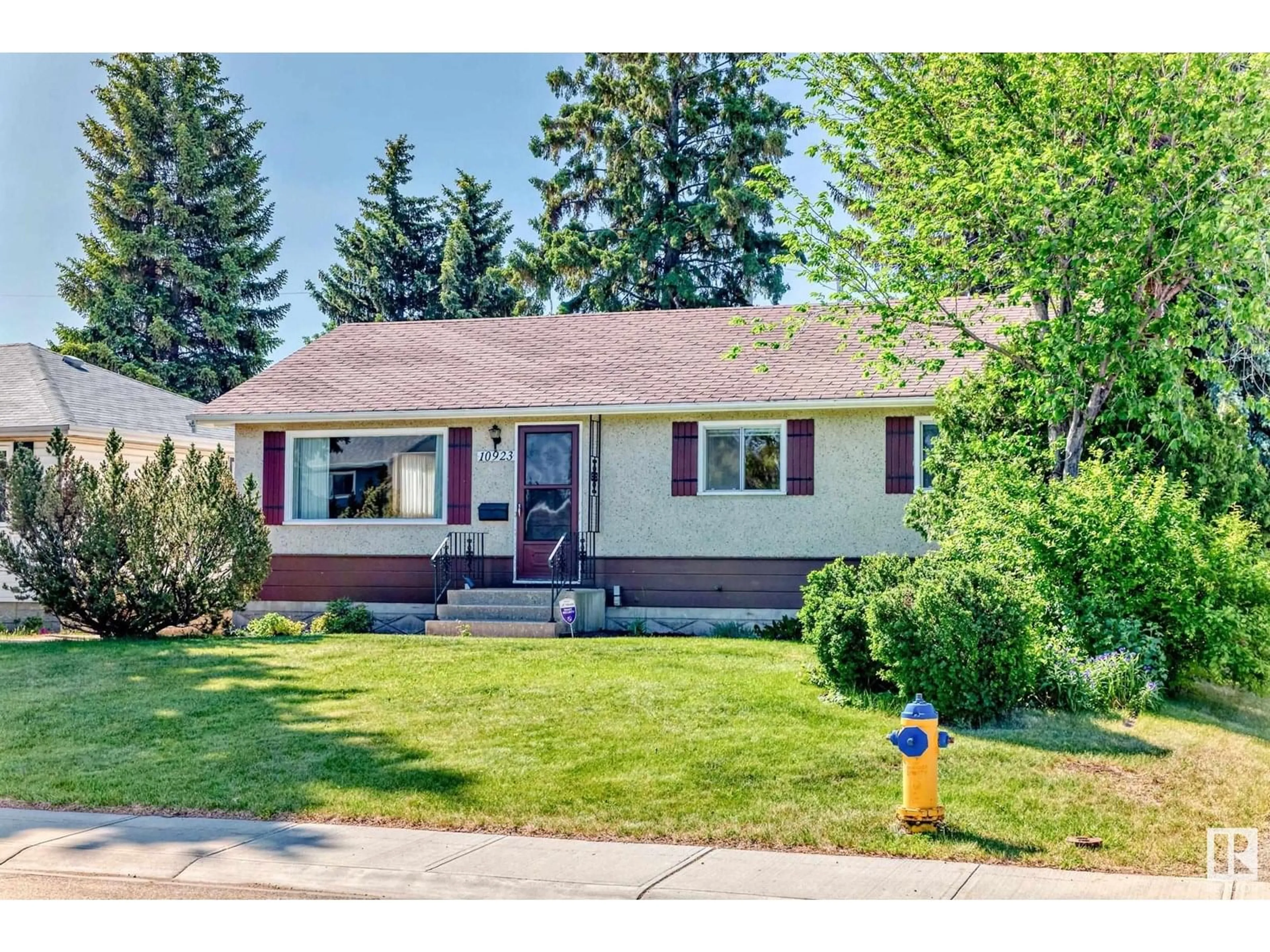 Home with vinyl exterior material, street for 10923 135A AV, Edmonton Alberta T5E1T2