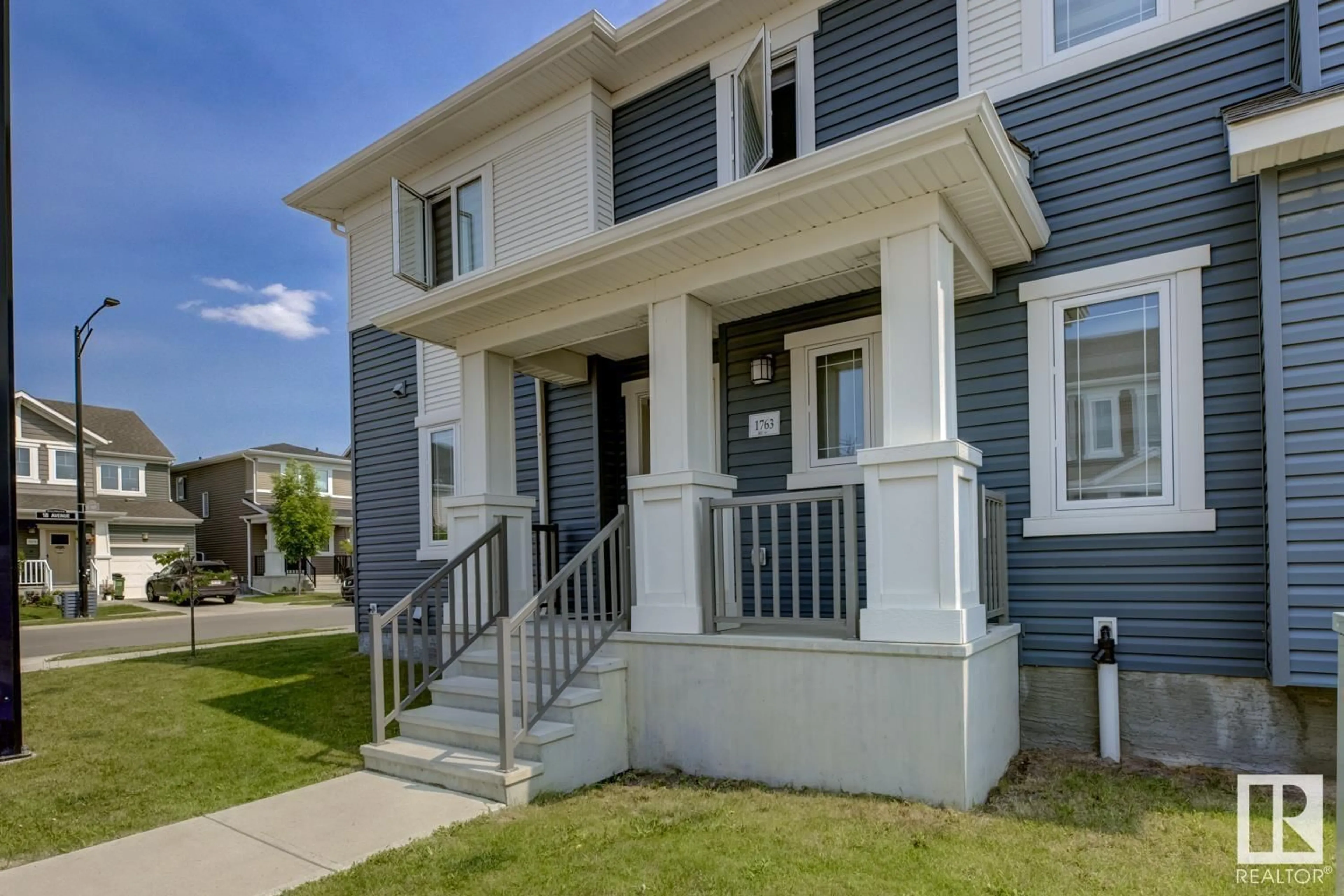 Home with vinyl exterior material, street for NW - 1763 201 ST, Edmonton Alberta T6M0Y1