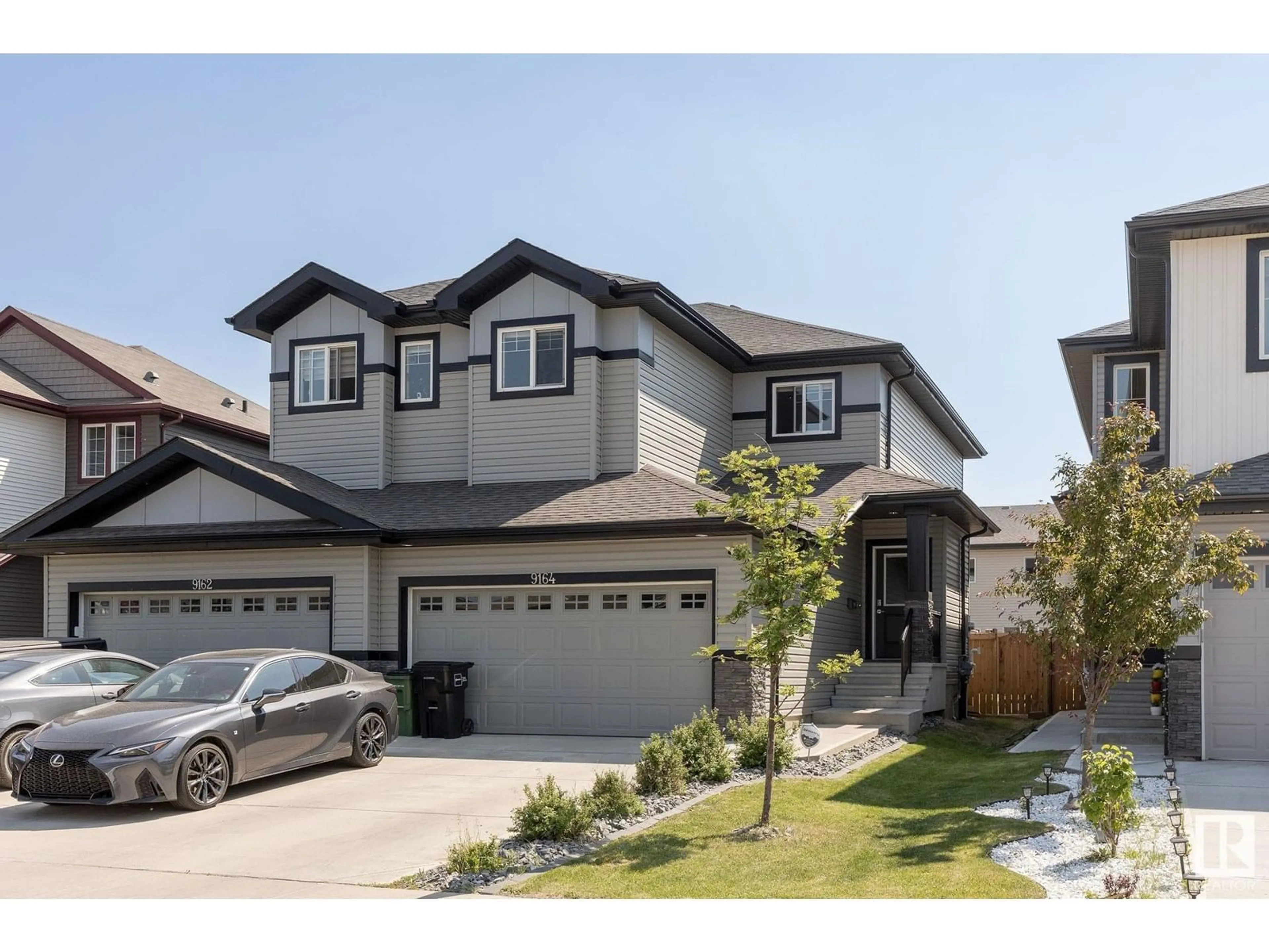 Home with vinyl exterior material, street for 9164 COOPER CR, Edmonton Alberta T6W3K9