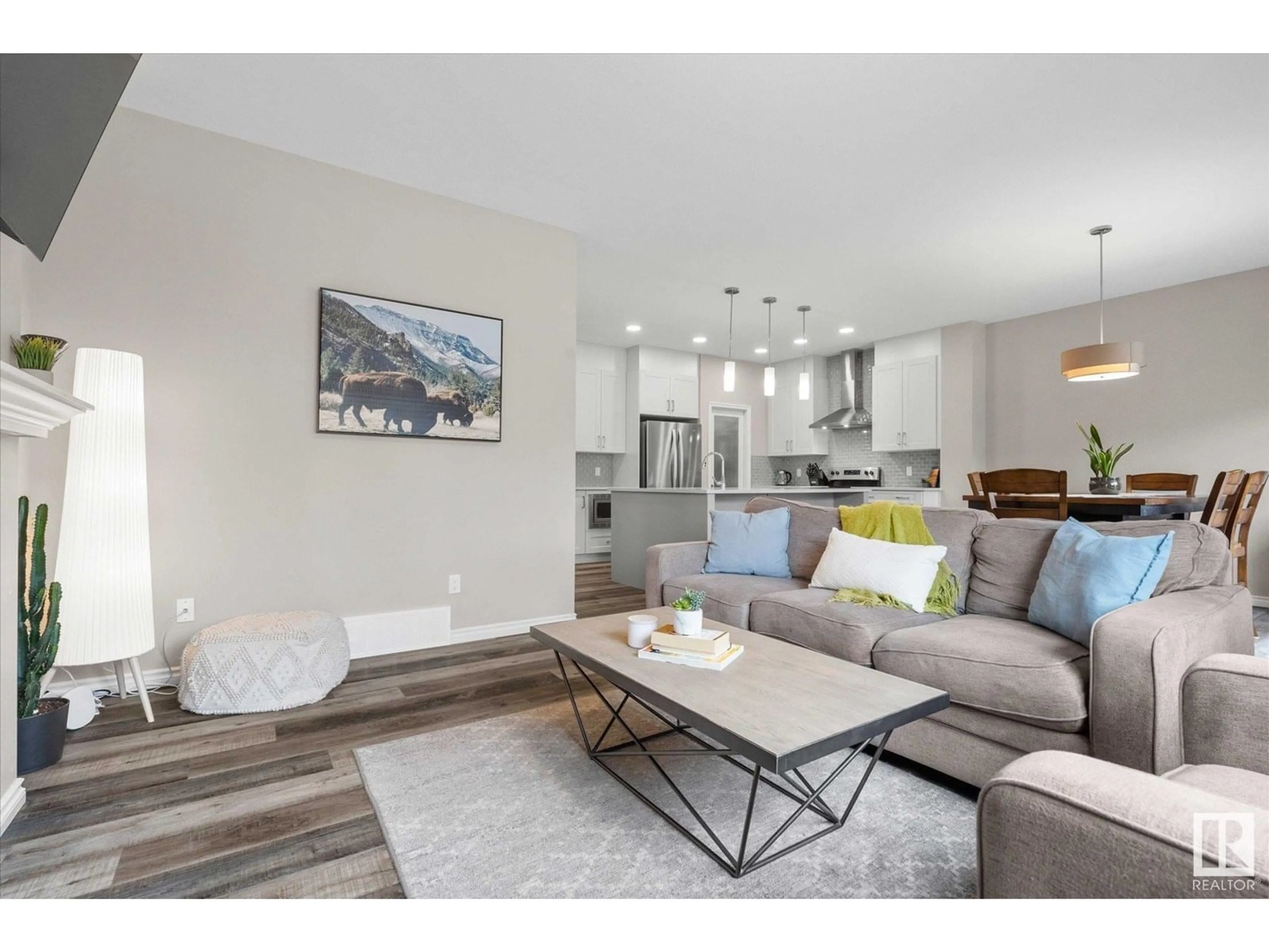 Living room with furniture, wood/laminate floor for 338 BALSAM LI, Leduc Alberta T9E1L4