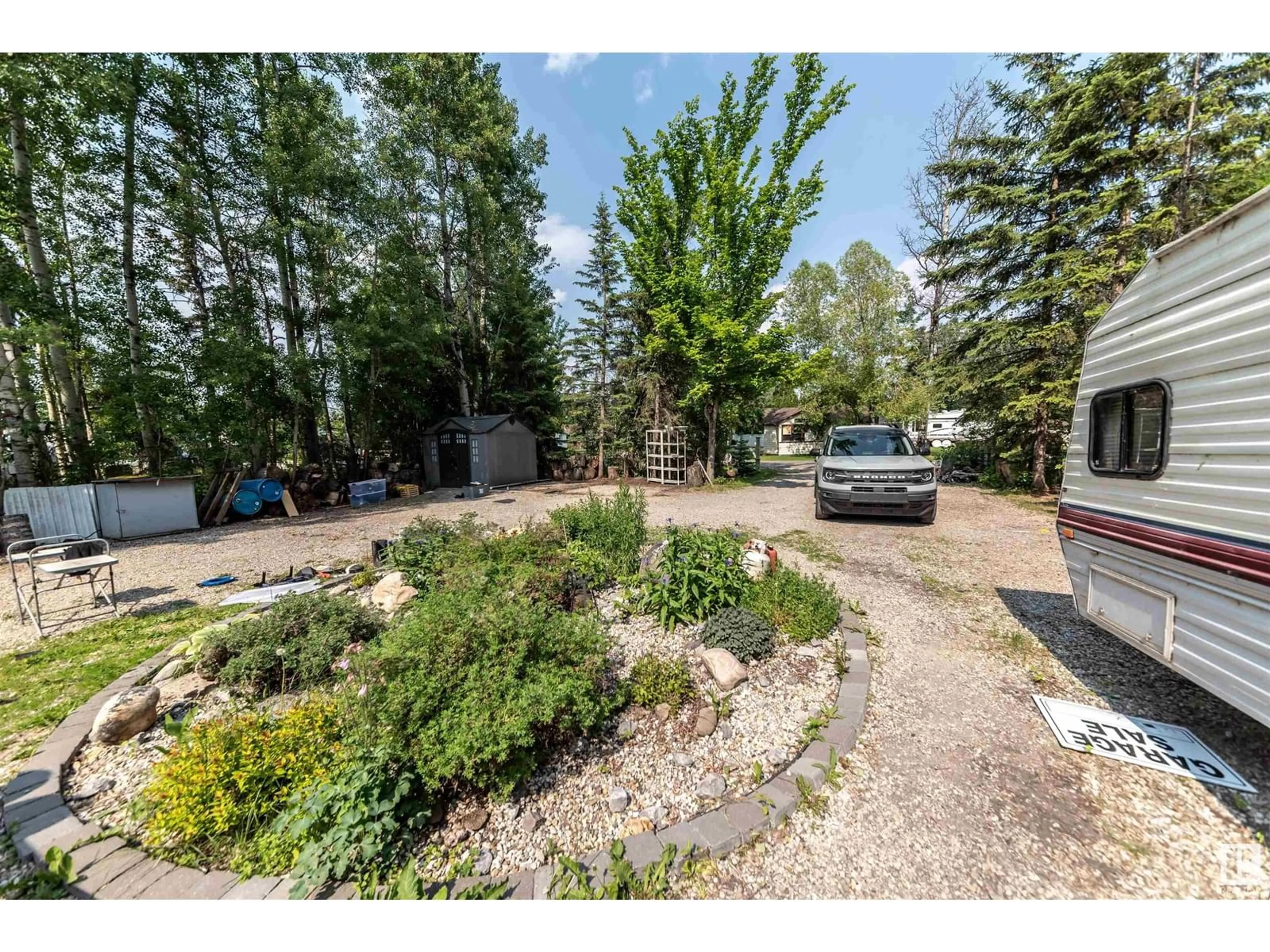 A pic from outside/outdoor area/front of a property/back of a property/a pic from drone, forest/trees view for 4824 53 ST, Rural Lac Ste. Anne County Alberta T0E0A0