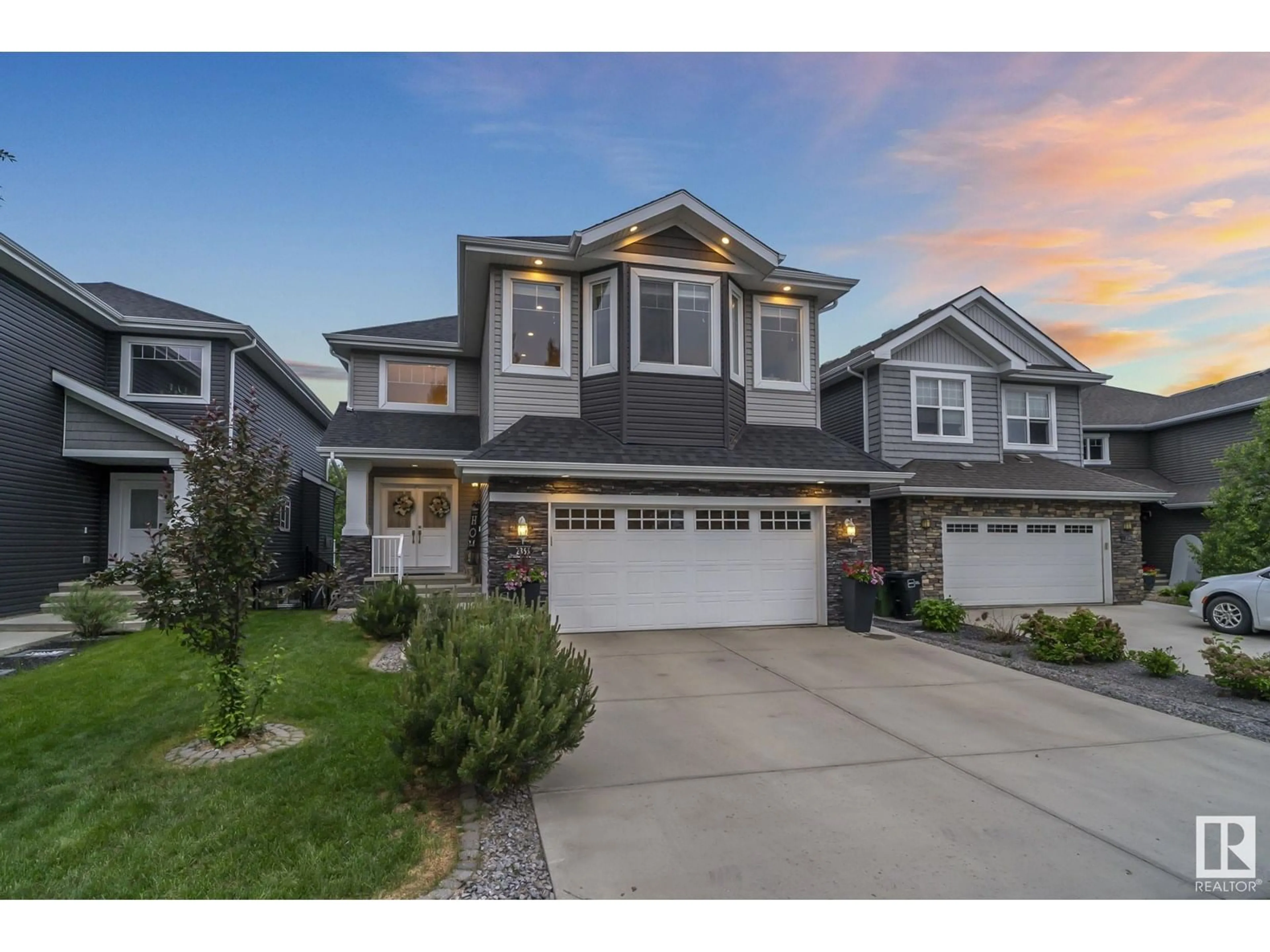 Home with vinyl exterior material, street for 2365 SPARROW CR, Edmonton Alberta T5S0G7